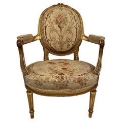 Fauteuil en bois doré de style Louis XVI, fin XIXe ou début XXe