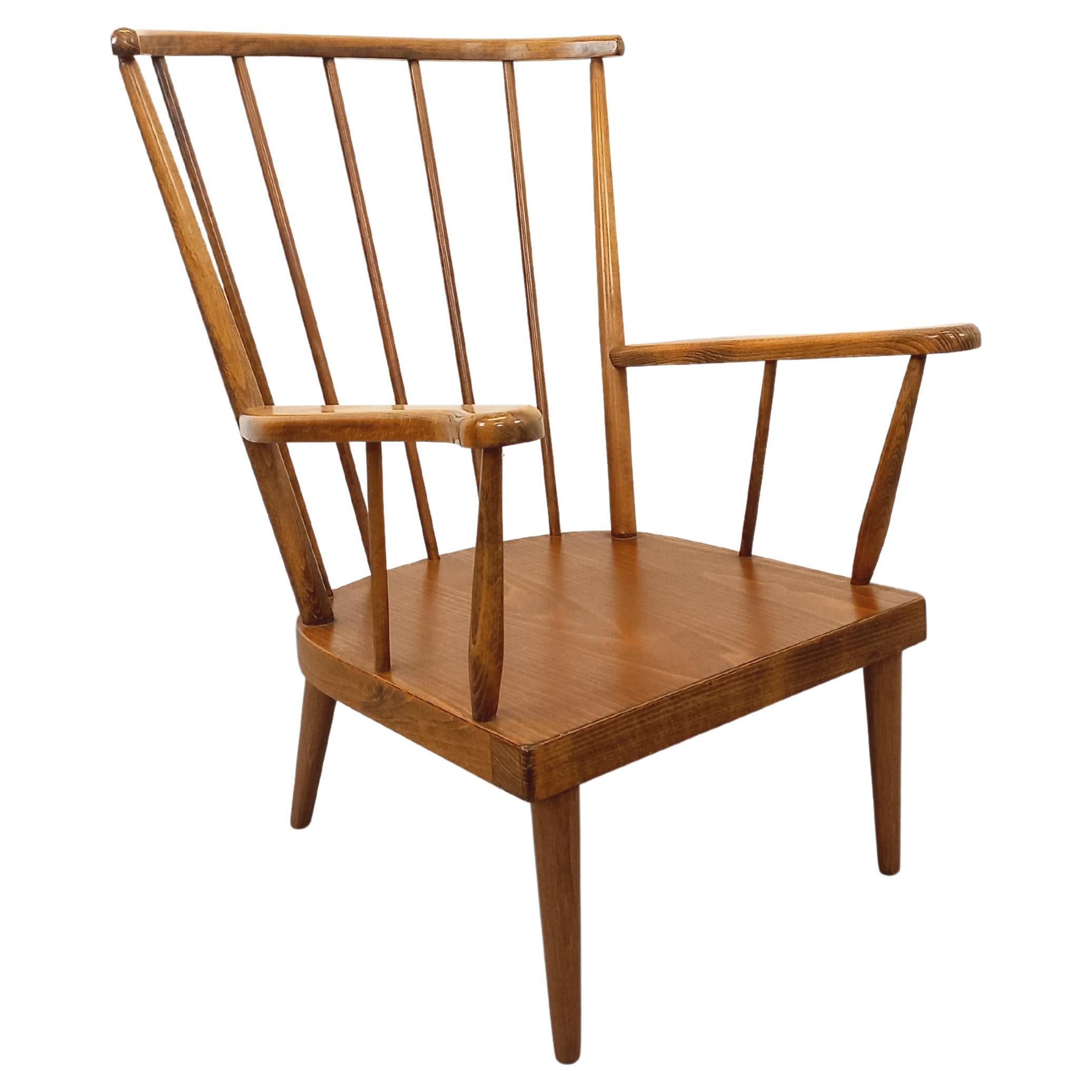 Fauteuil en bois vintage Baumann modèle Éventail des années 60 in vendita
