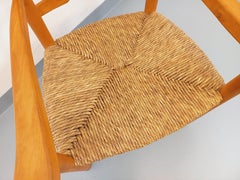 Fauteuil vintage en bois de hêtre et paille des années 50