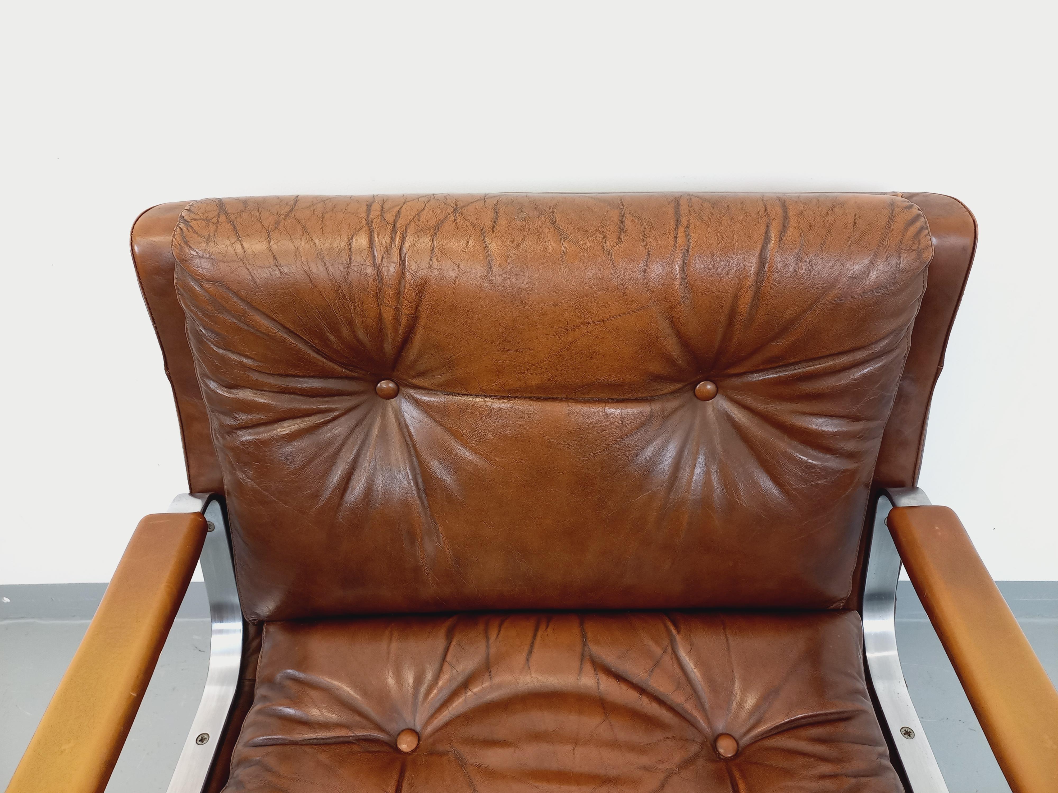 Métal Fauteuil vintage Raphaël Raffel en cuir et acier des années 70