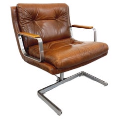 Fauteuil vintage Raphaël Raffel en cuir et acier des années 70