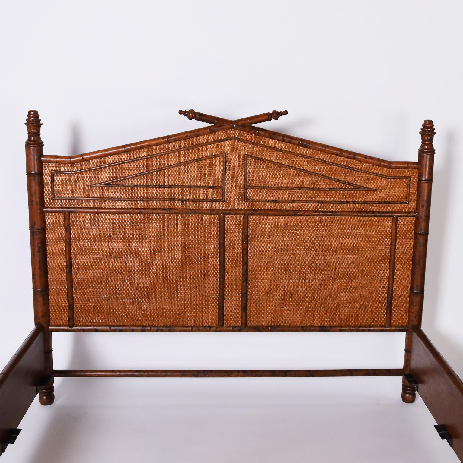 British colonial style queen size bed frame with a faux bamboo frame having a faux tortoise finish and grasscloth panels with applied faux bamboo geometric designs. 

Inside Measurements W: 64 D: 80.