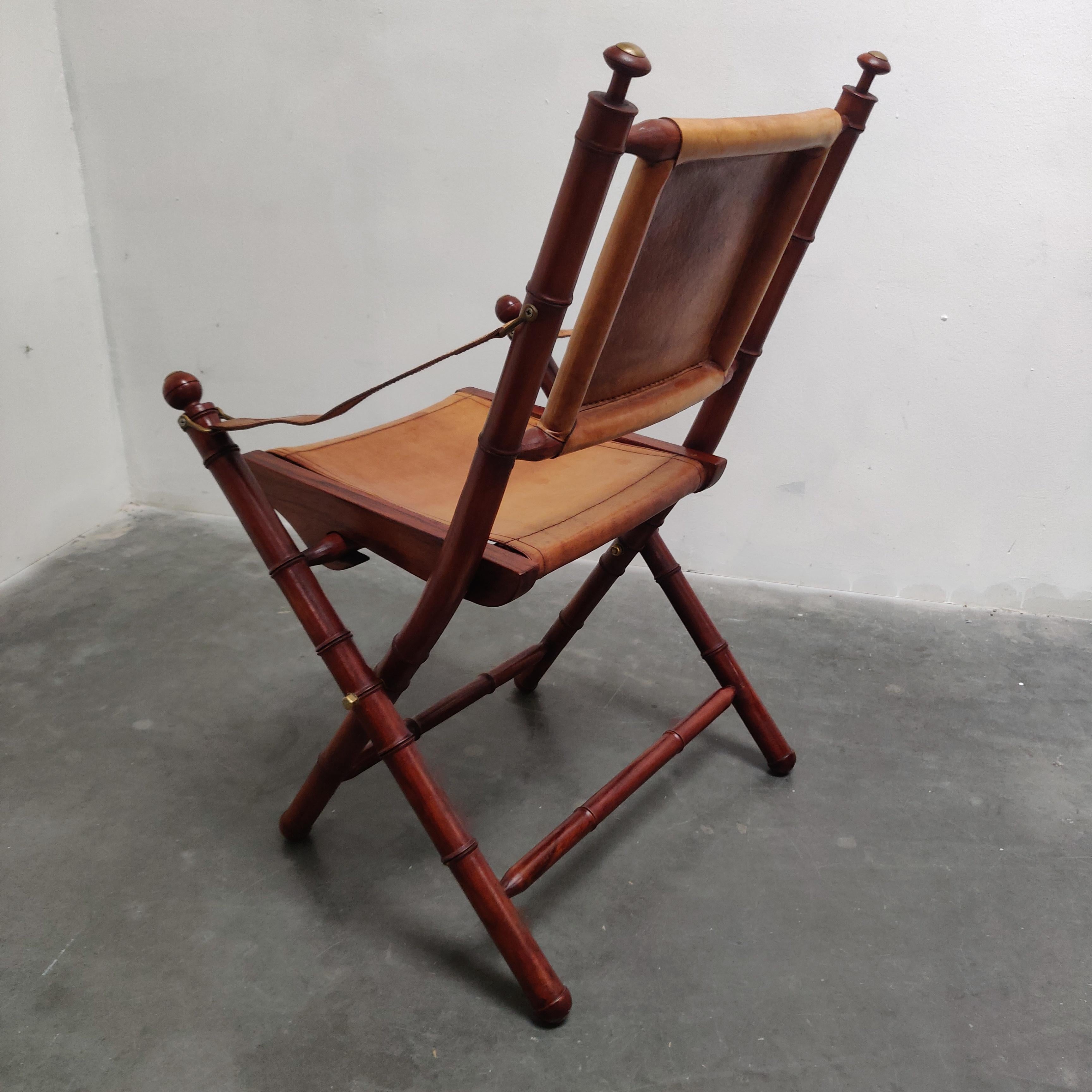 British Colonial Faux Bamboo and leather folding officer safari chair. For Sale