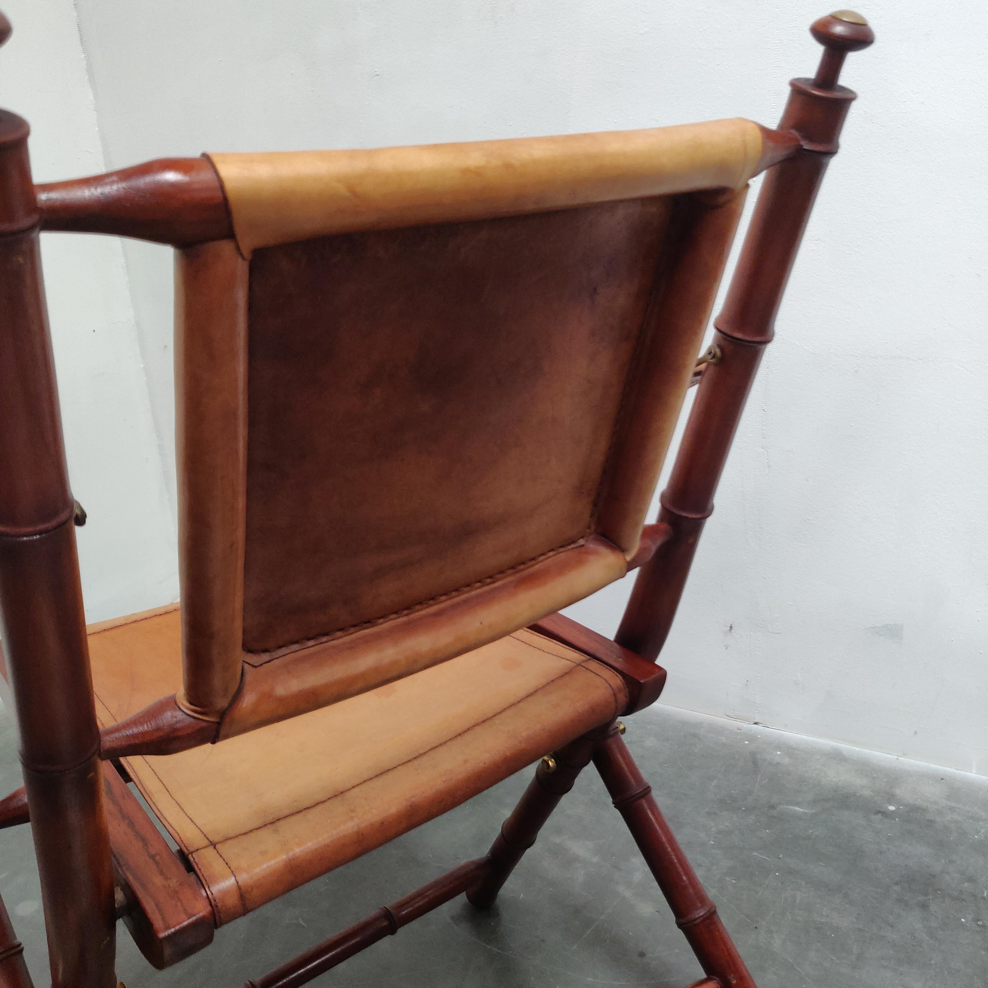 English Faux Bamboo and leather folding officer safari chair. For Sale