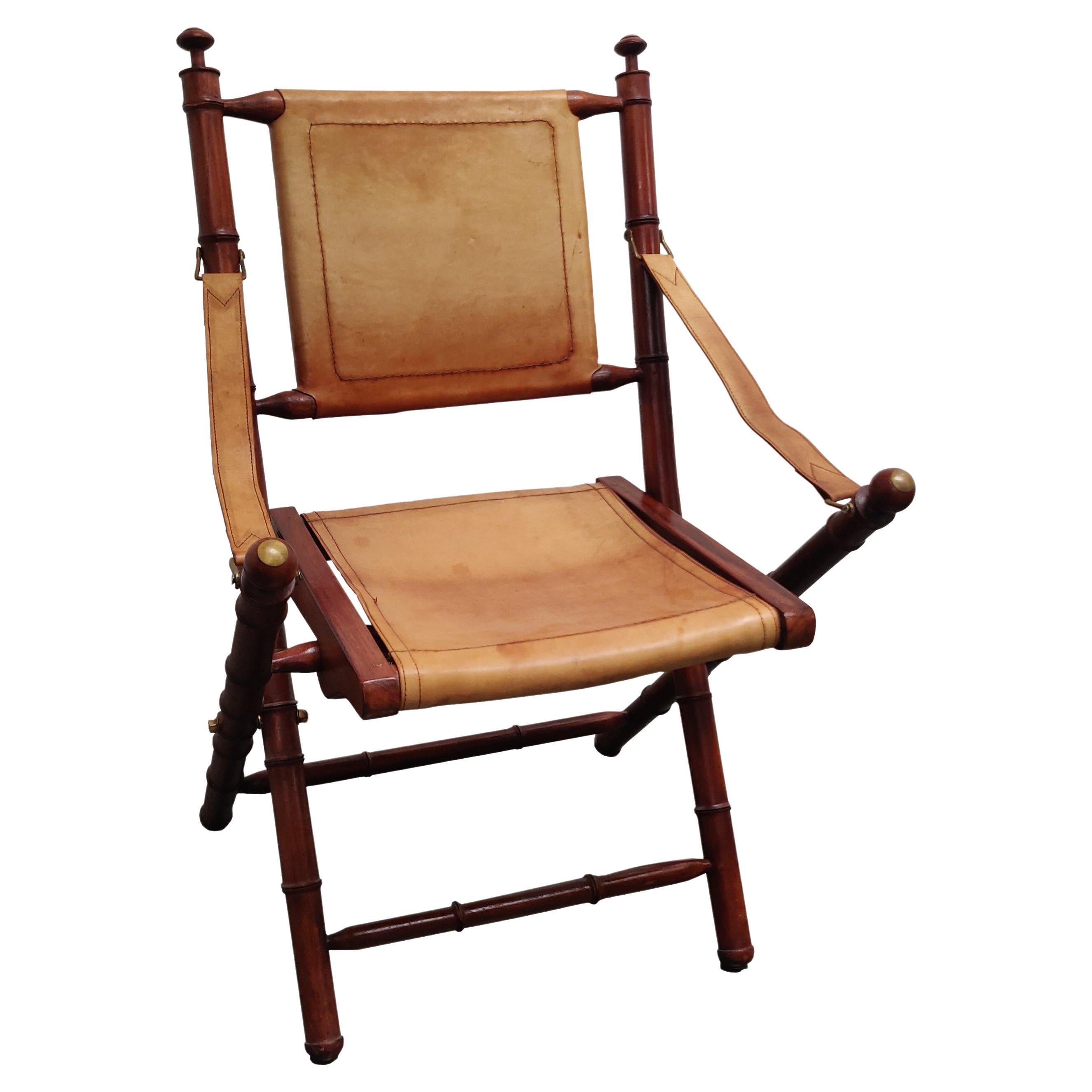 Faux Bamboo and leather folding officer safari chair. For Sale