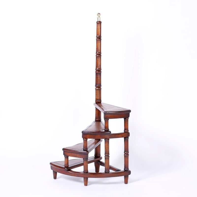 Library stairs or steps crafted in mahogany with faux bamboo supports topped with a brass finial.