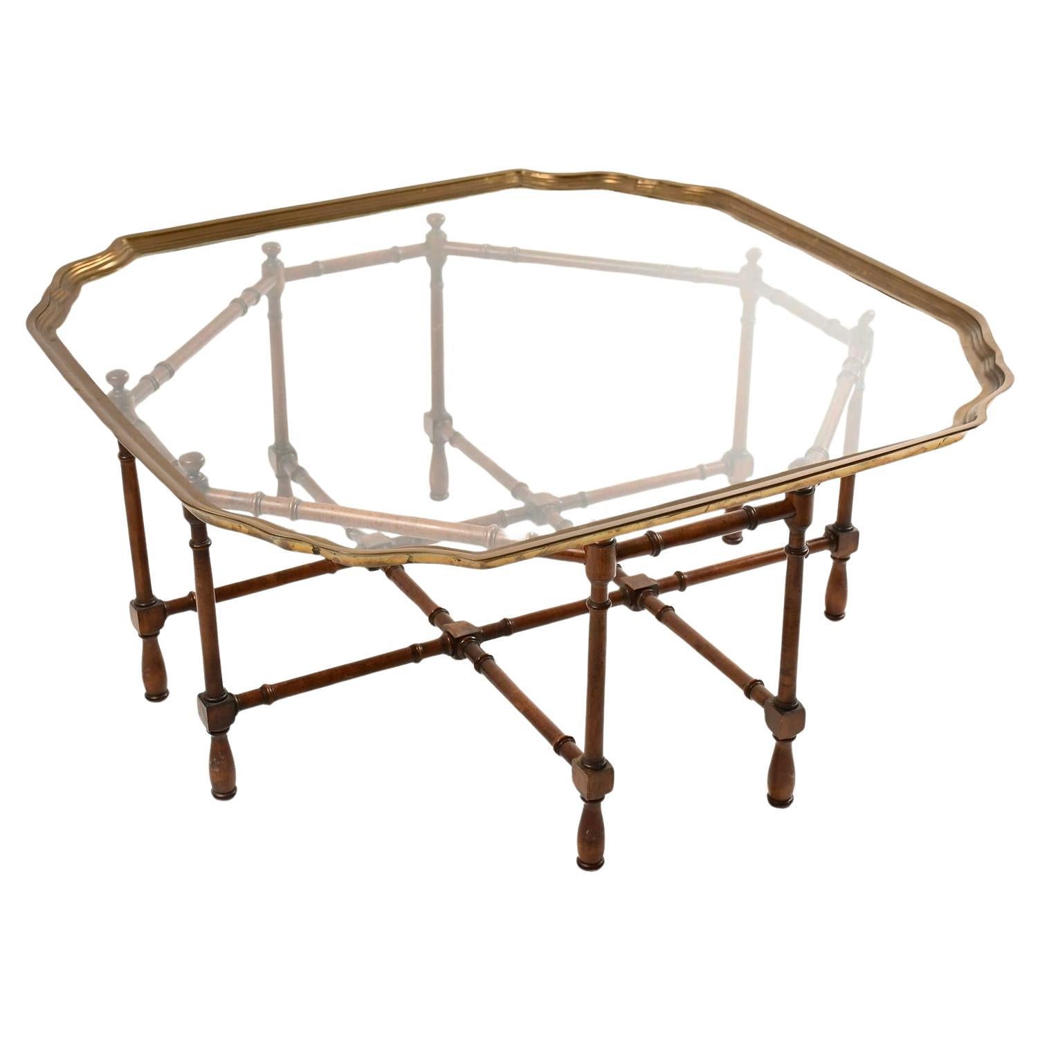 Vintage Baker scalloped glass and brass faux tortoise bamboo coffee table. Mid-century attributed to Baker Chippendale bamboo, brass & glass cocktail table with a shaped glass surface & lacquered brass trim resting upon a turned wooden tortoise