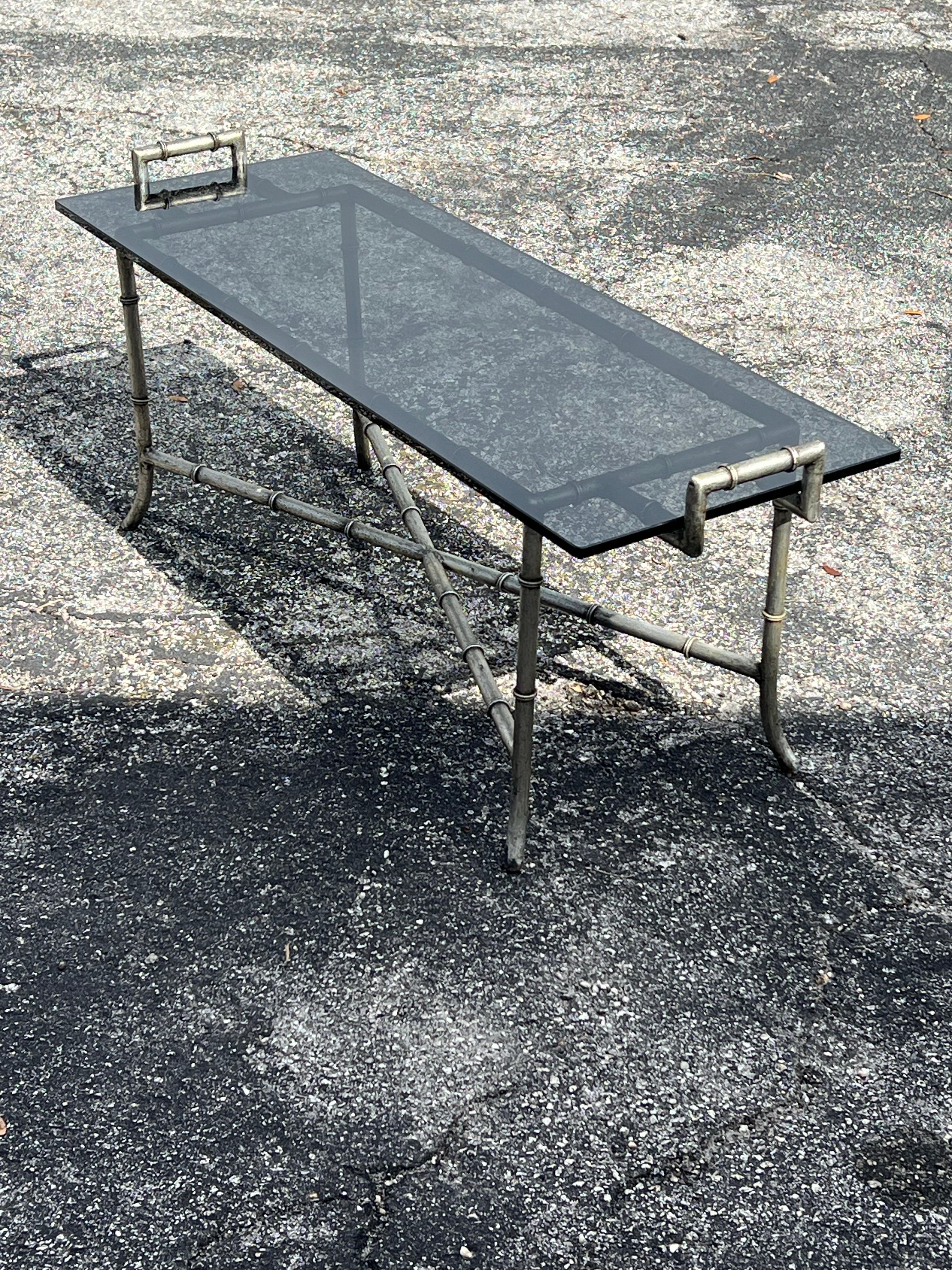 An unusual Hollywood regency bench or coffee table, faux bamboo. Heavy-made of solid steel/iron with a silver leaf style finish, ca' 1970's.