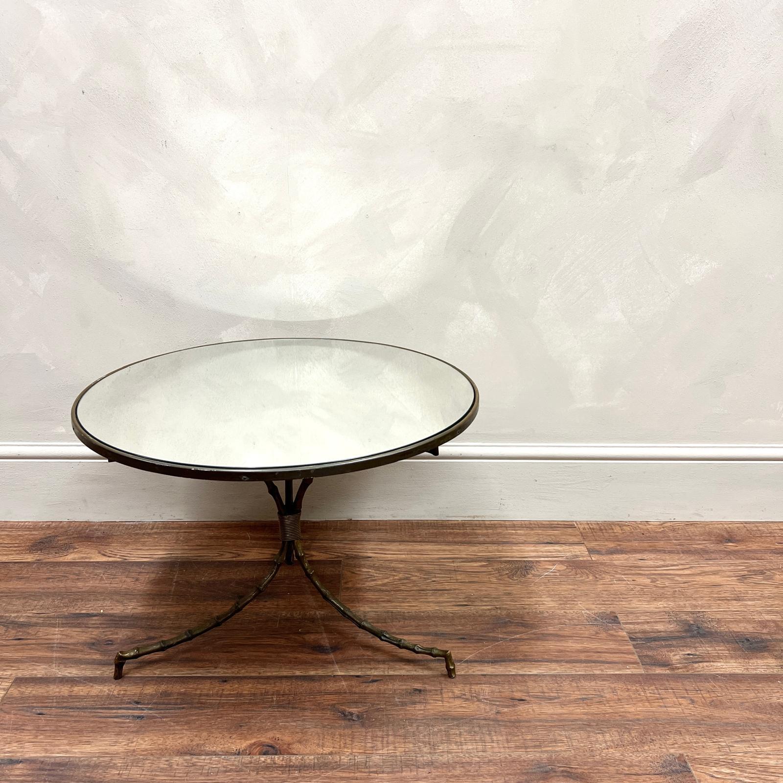 Faux Bamboo, Brass and (later) Mirrored Glass Coffee Table.
Attributed to Maison Jansen.
Very stylish and sturdy , would look great next to a chair with a  lamp placed on it .

France, circa 1920.
Dimensions:H: 40.5cm (15.9
