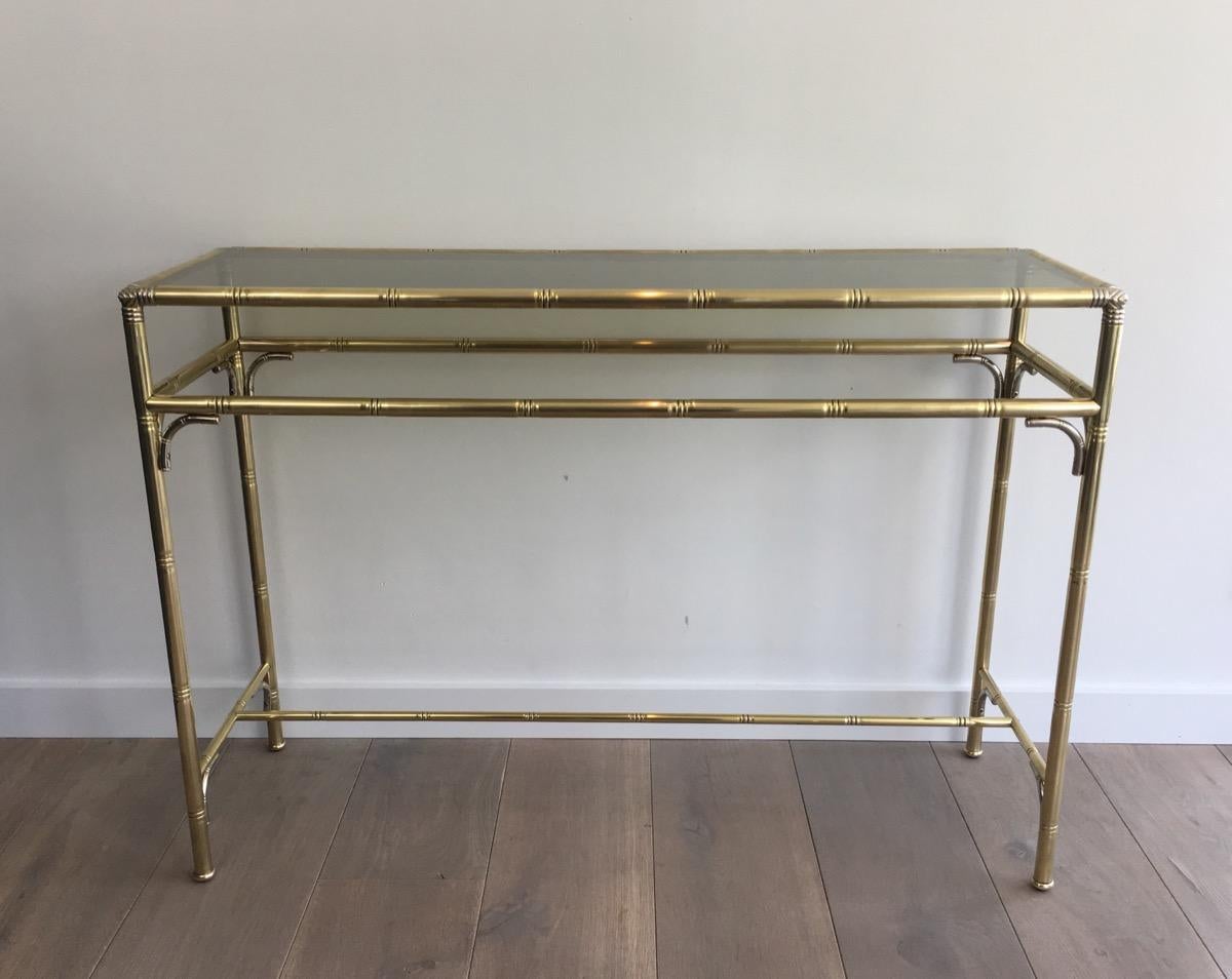 Faux-bamboo brass and silvered console table with smoked glass, French, circa 1970.
    