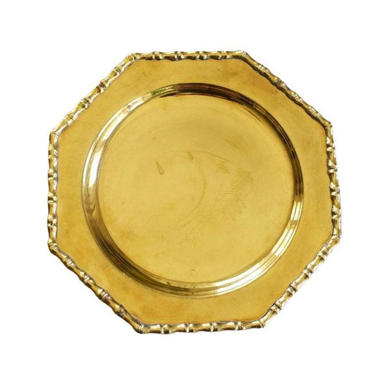 A staple in entertaining, this pair of brass faux bamboo chargers will elevate your next dinner party. With faux bamboo details around the edges, this set will add the perfect touch of chinoiserie to any place setting. Created from brass, and made