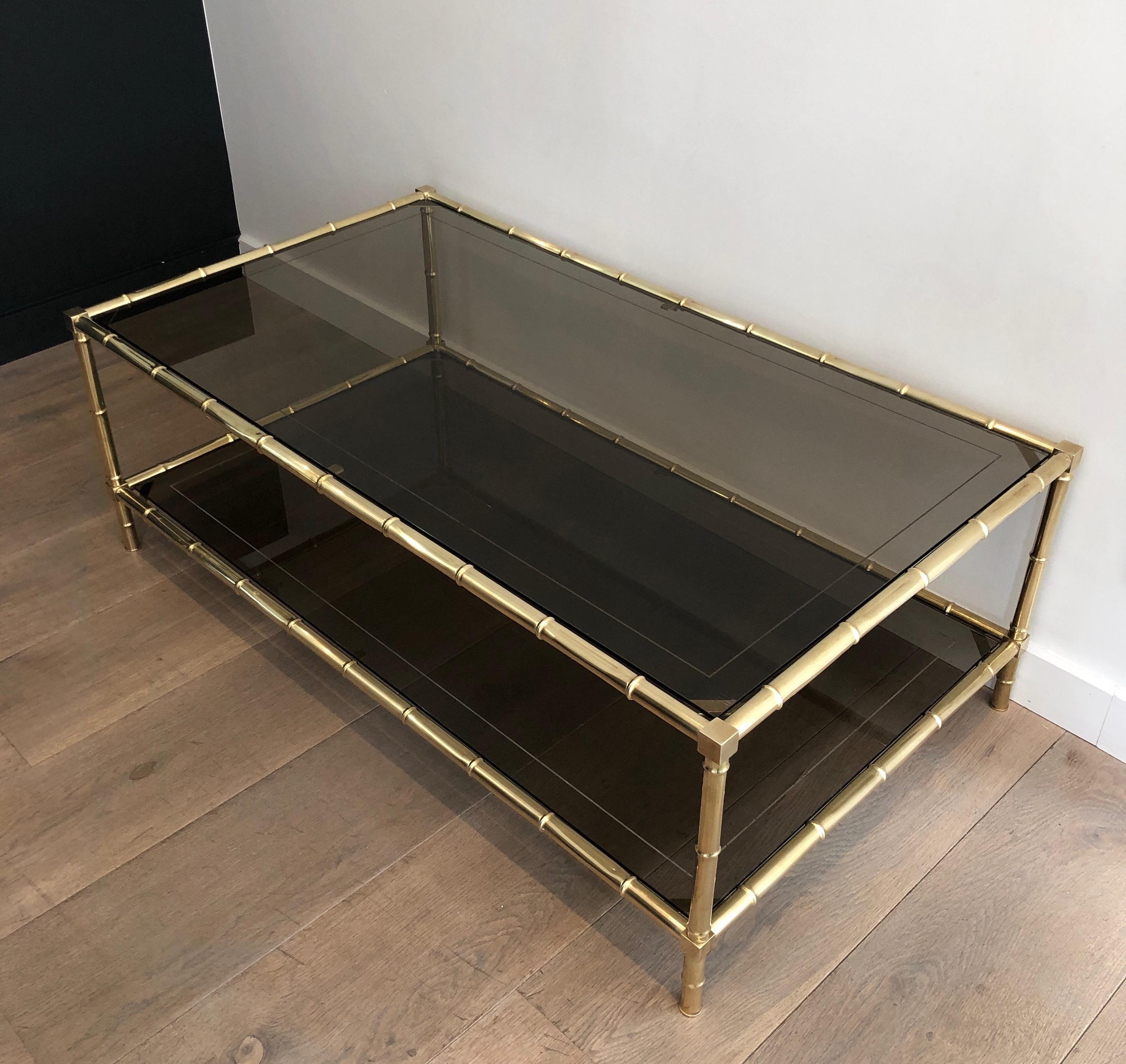 This faux-bamboo coffee table is made of brass. This is a French work, attributed to famous designer Jacques Adnet, circa 1970.