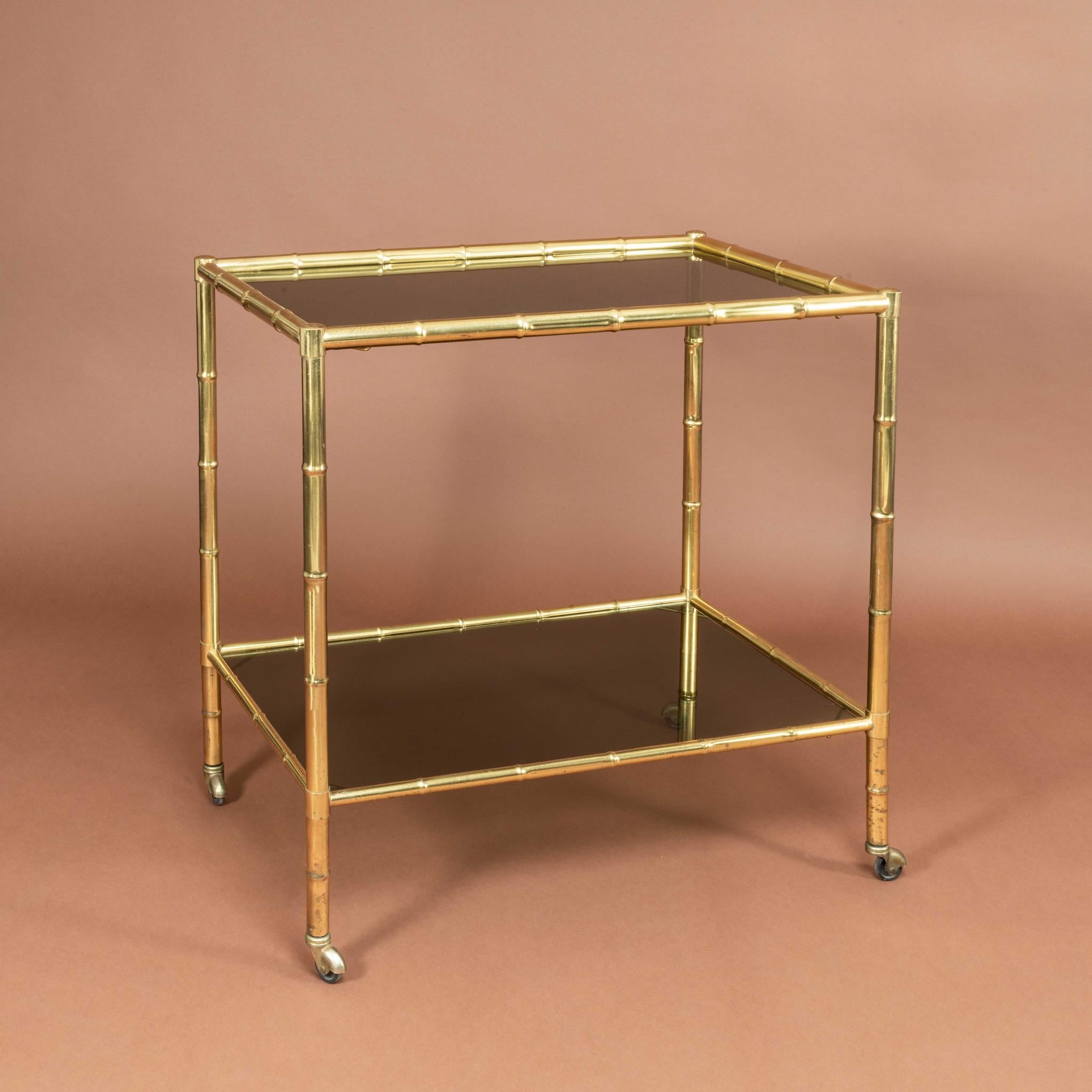 Fantastic 1960’s cocktail trolley with faux-bamboo brass frame and smoked glass shelves.


Dimensions: 73.75 cm/29 inches (length) x 45.75 cm/18 inches (width) x 72.25 cm/28½ inches (height).


Bentleys are Members of LAPADA, the London and