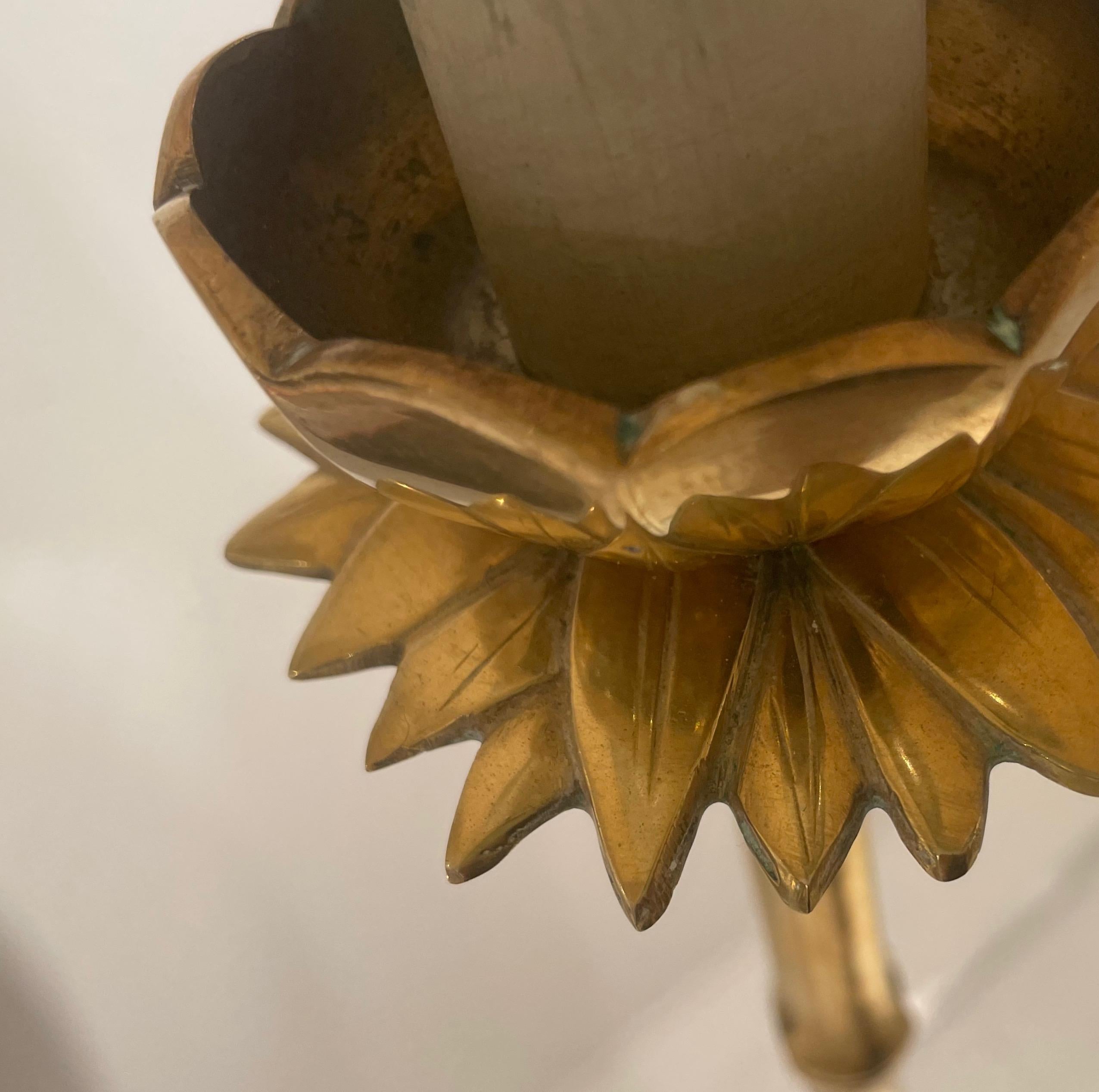 Elegant  brass faux bamboo floor lamp with a lotus flower finely carved on top.
One light and an opaline reflector.
By Maison Bagués - France.
1980.