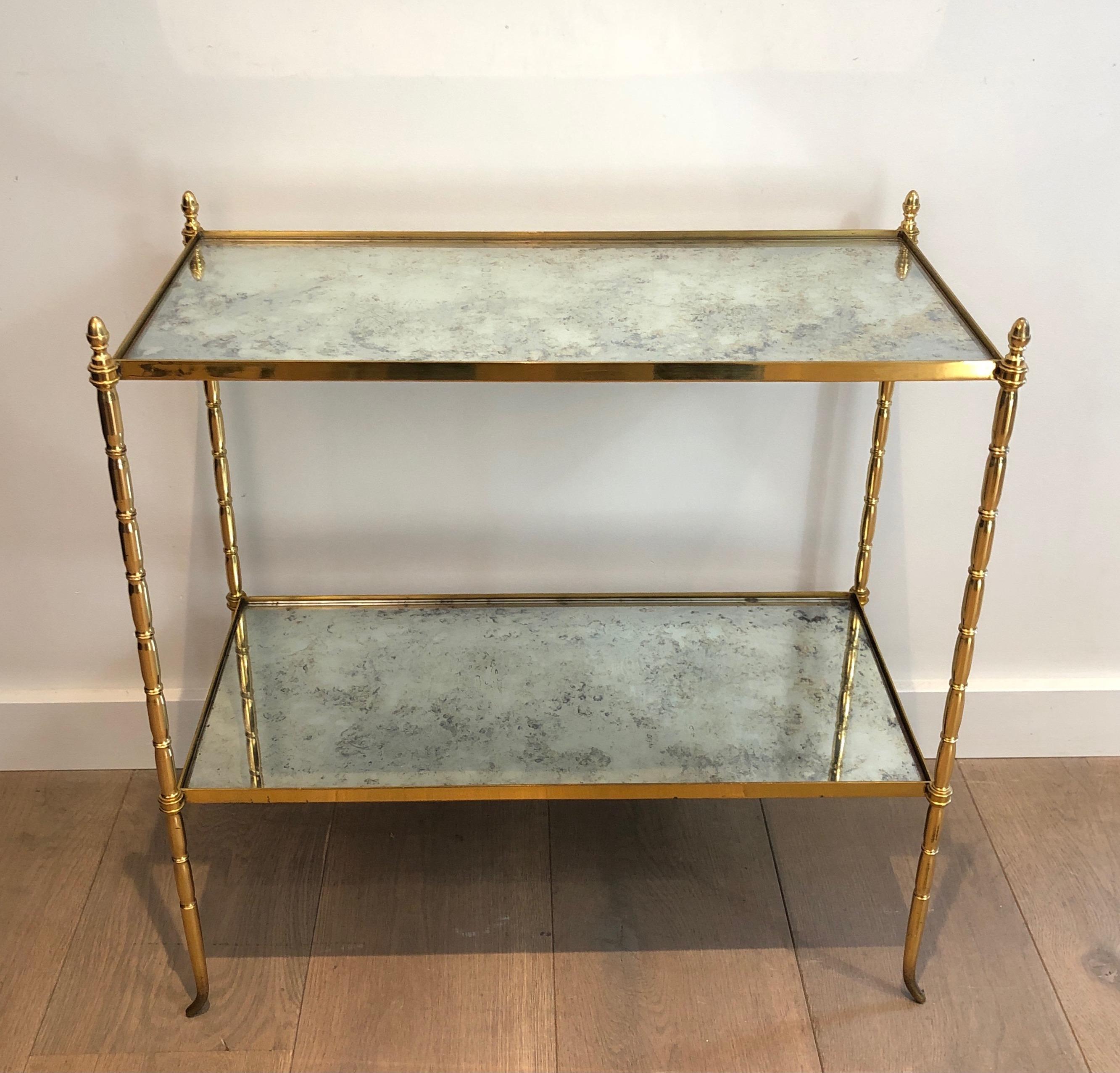 Faux-bamboo brass side table with eglomised glass shelves. French work by Maison Bagués. Circa 1940.