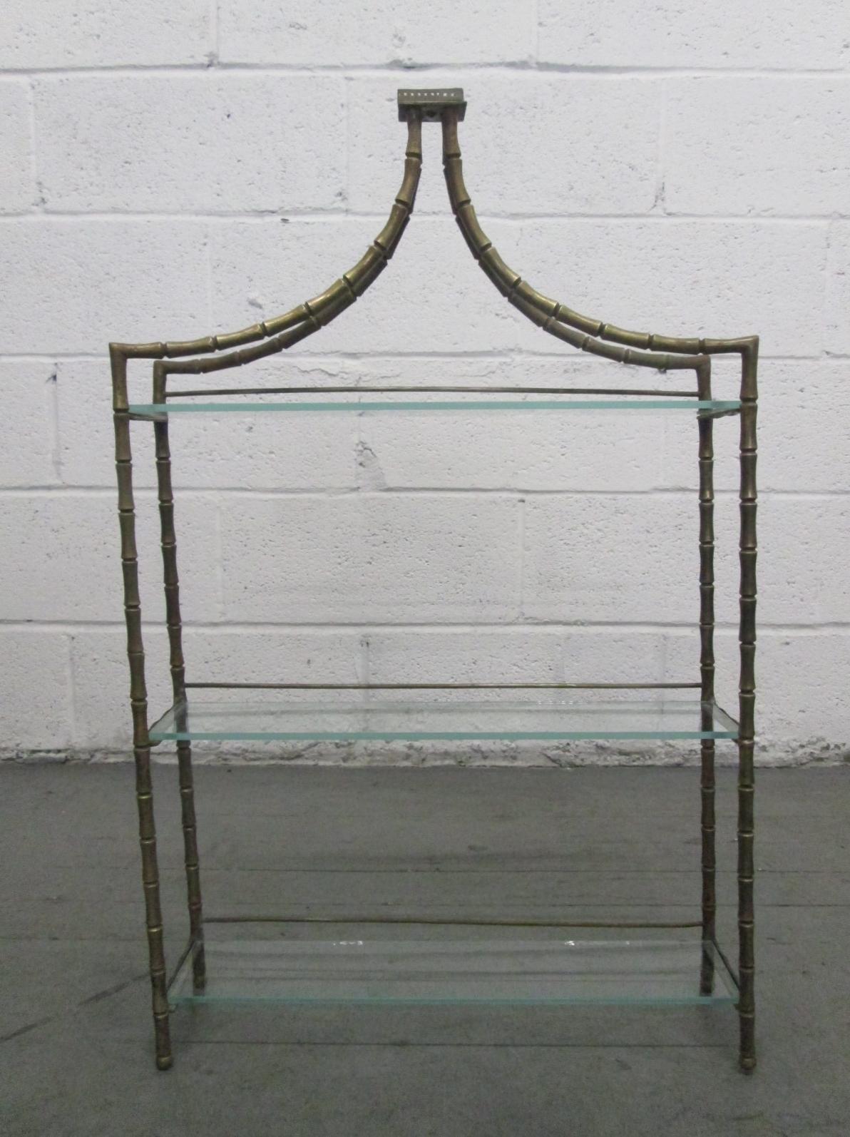 Faux bamboo bronze shelf in the style of Maison Baguès. Has three glass shelves and a nice greenish patina to the bronze.