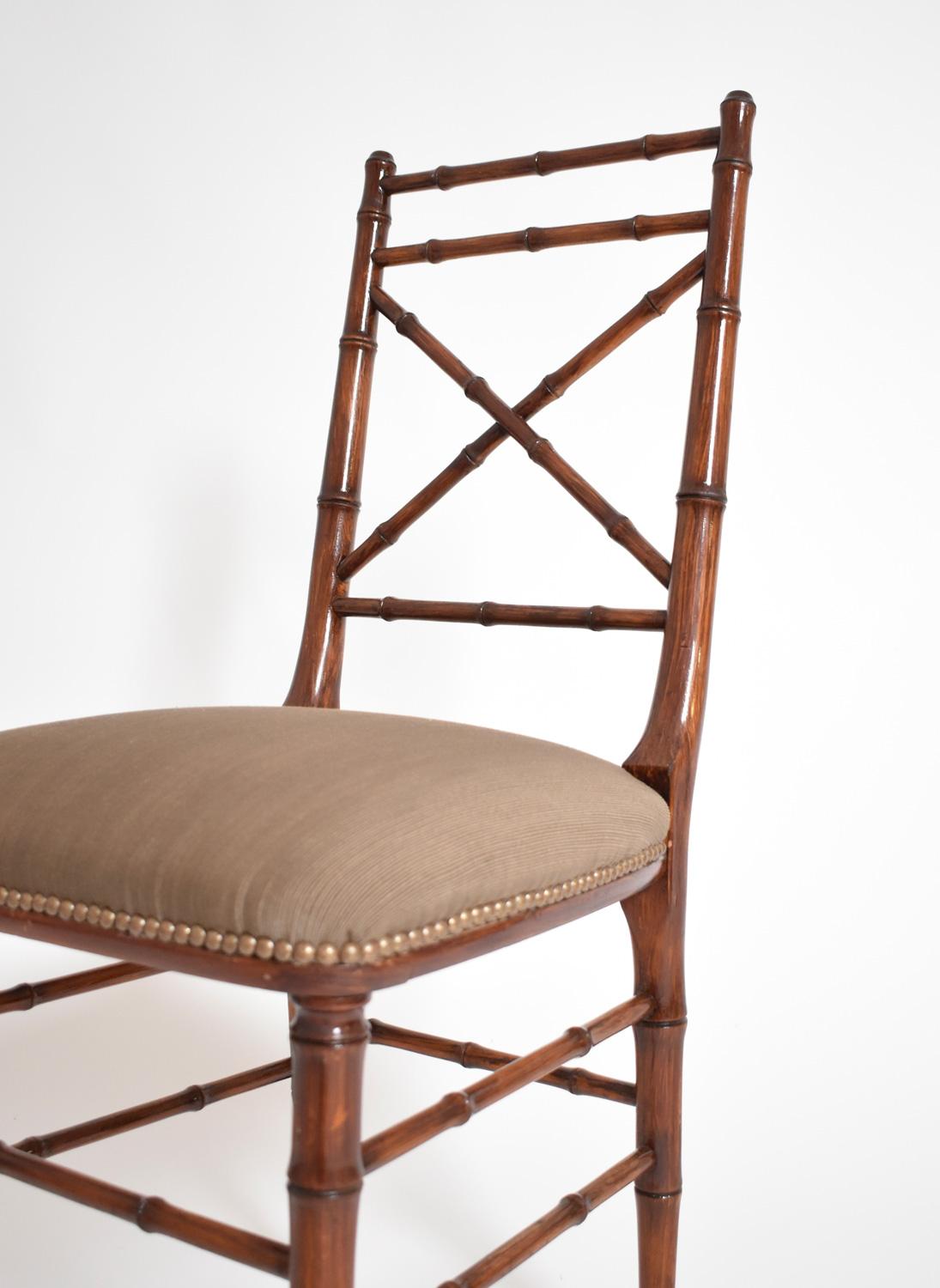 Faux bamboo natural wood chair, with cross-braced back, the 4 legs connected by spacers. France, 1960s.