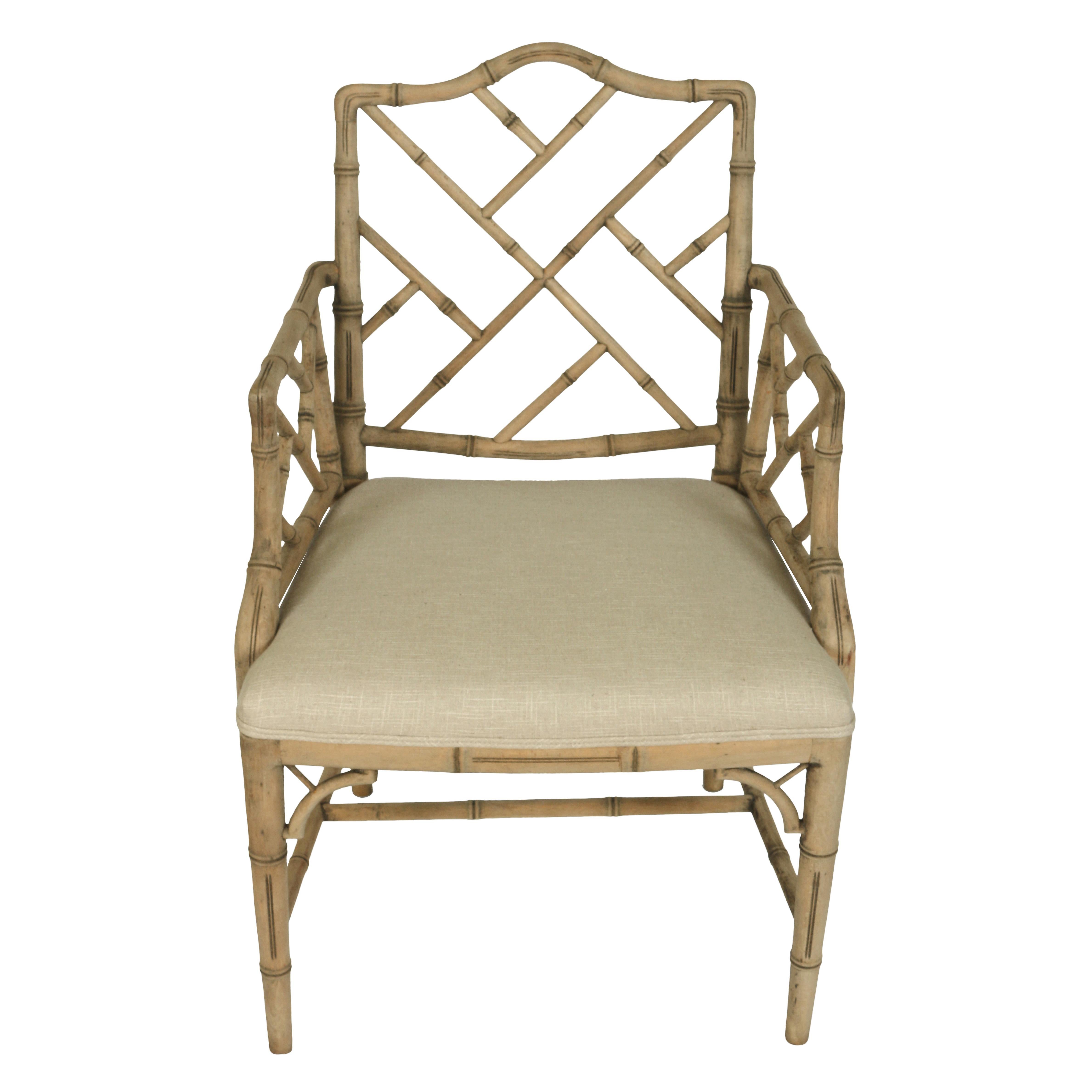 Perfect as a pull-up chair or at a desk, this faux bamboo chair in the Chinese Chippendale style features a bleached wood finish and a seat upholstered in a natural linen.