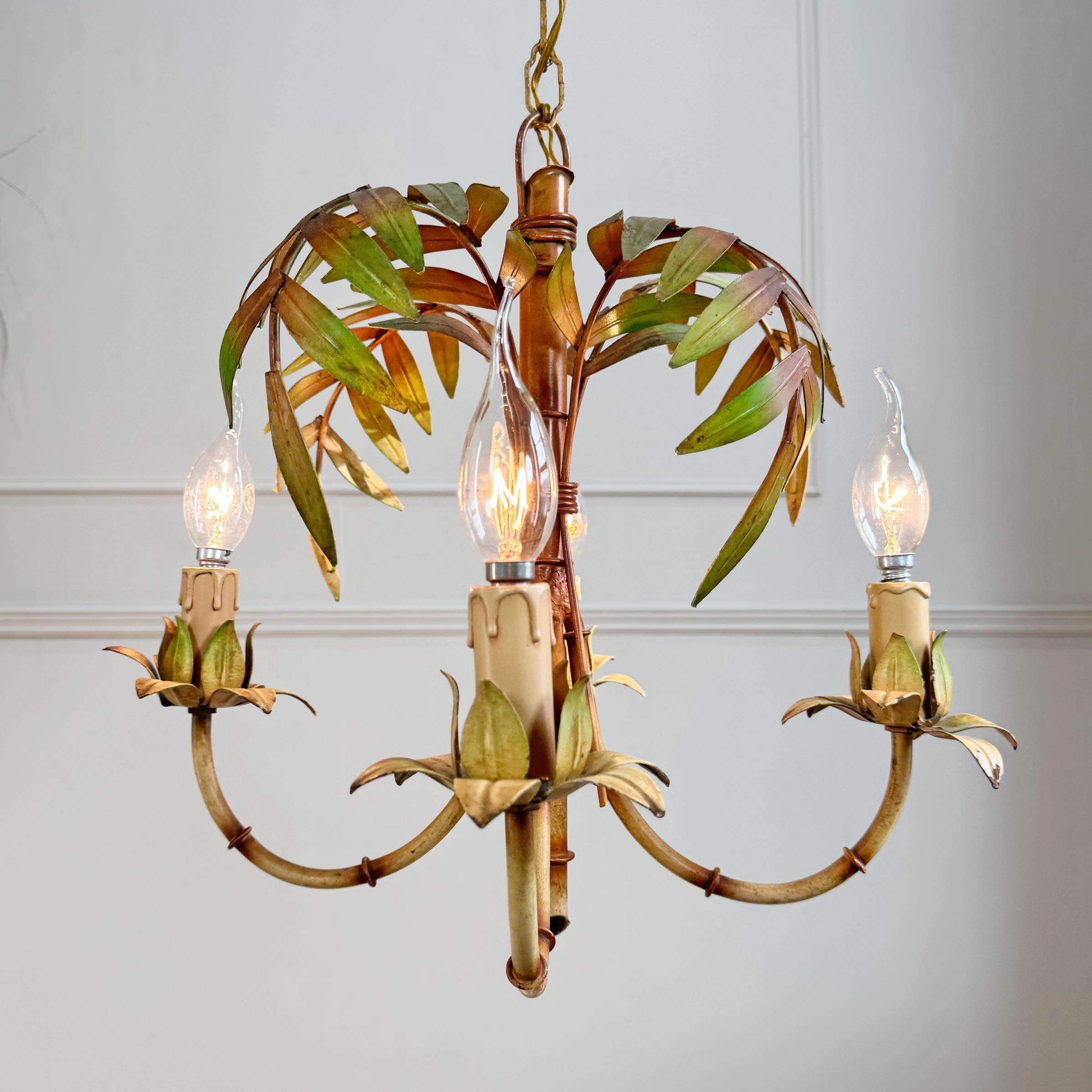 Palm leaf and faux bamboo chandelier, Italy 1950's

A beautiful chandelier featuring hand painted faux bamboo stems and leaf fronds throughout



There are 4 bulb holders which take E14 small screw in bulbs. Has it's Original Made In Italy