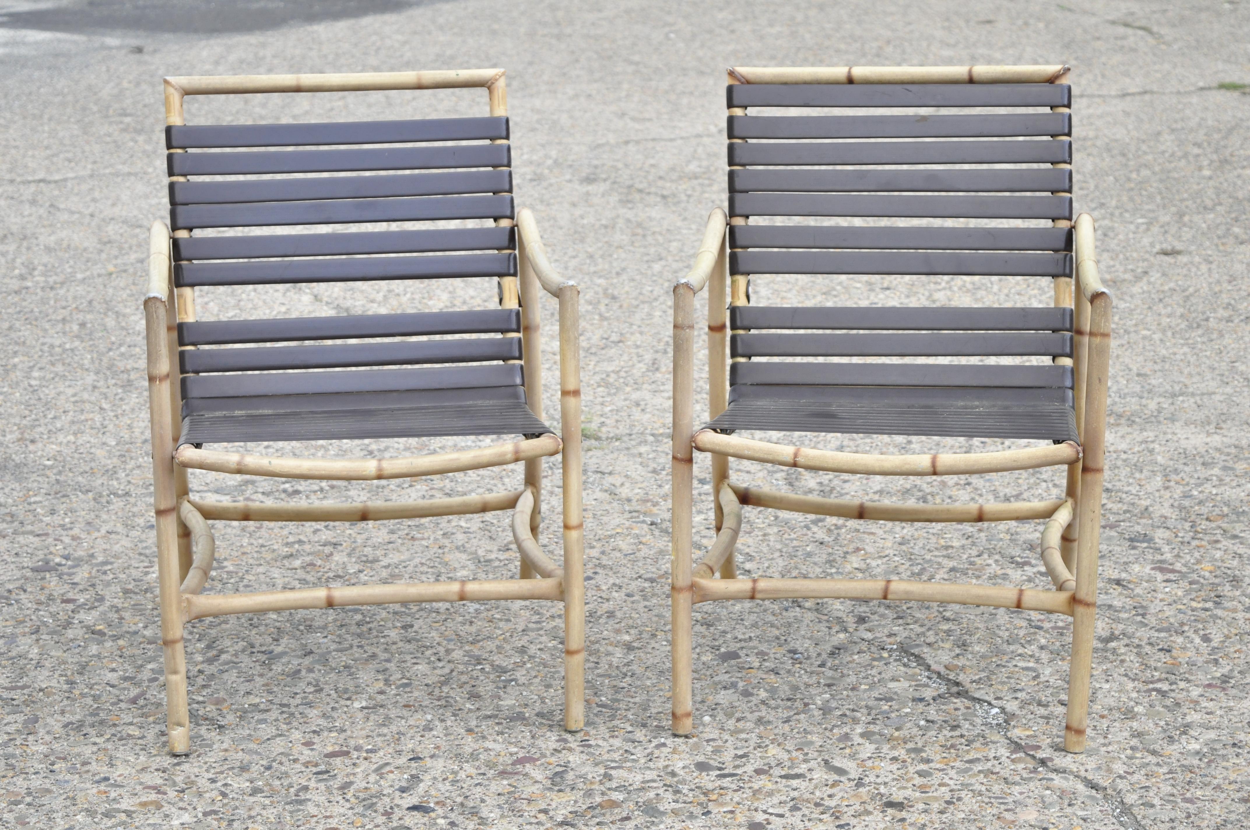 20th century faux bamboo Chinese Chippendale aluminum vinyl strap patio armchairs, a pair. Item features rubberized vinyl straps, faux bamboo design, cast aluminum construction, great style and form, circa late 20th century. Measurements: 33