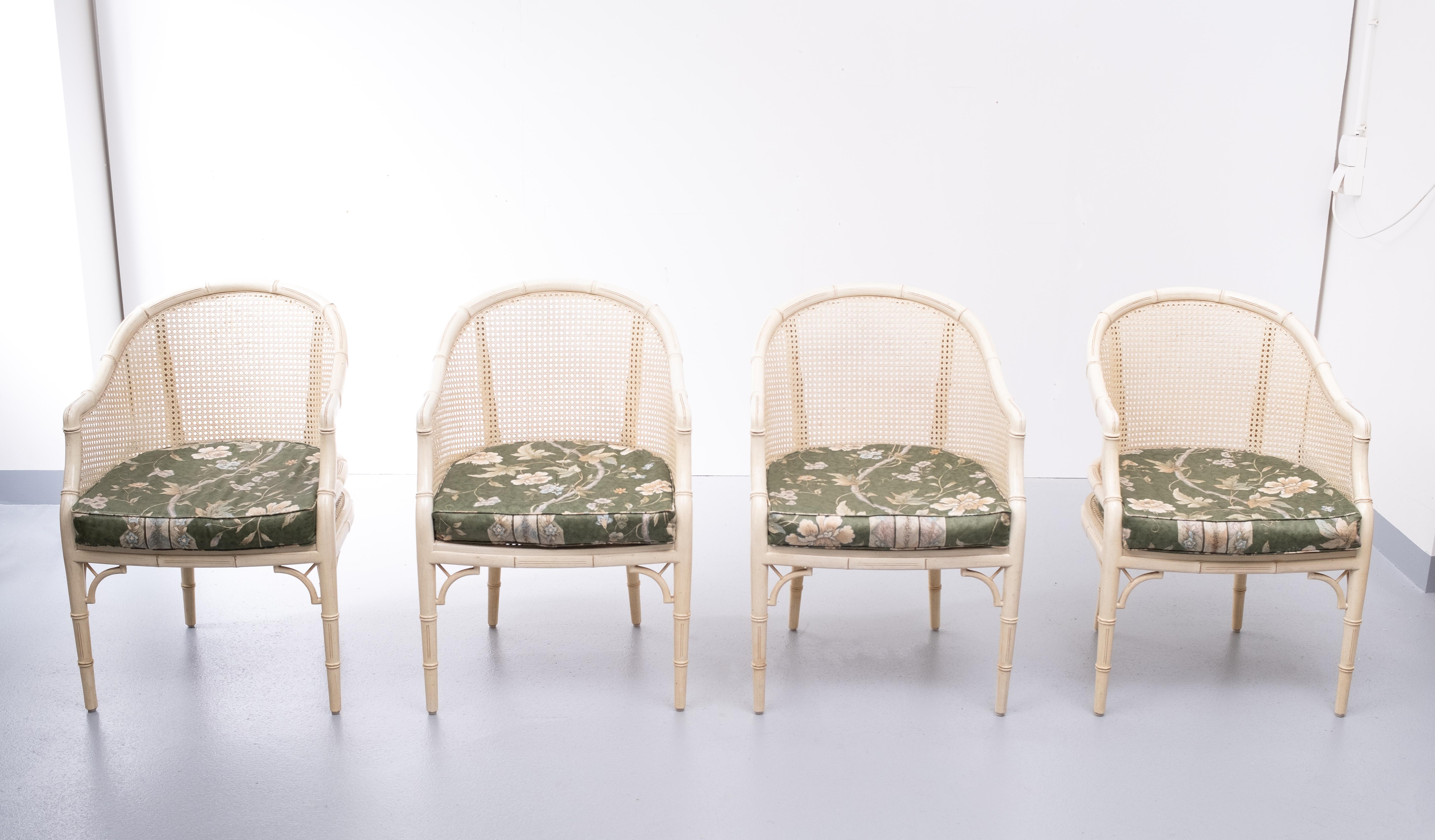 Faux bamboo Chinese Chippendale armchairs. Wicker seating and back. Off white color.
Comes with silk flower pattern pillows. Very good condition.
 