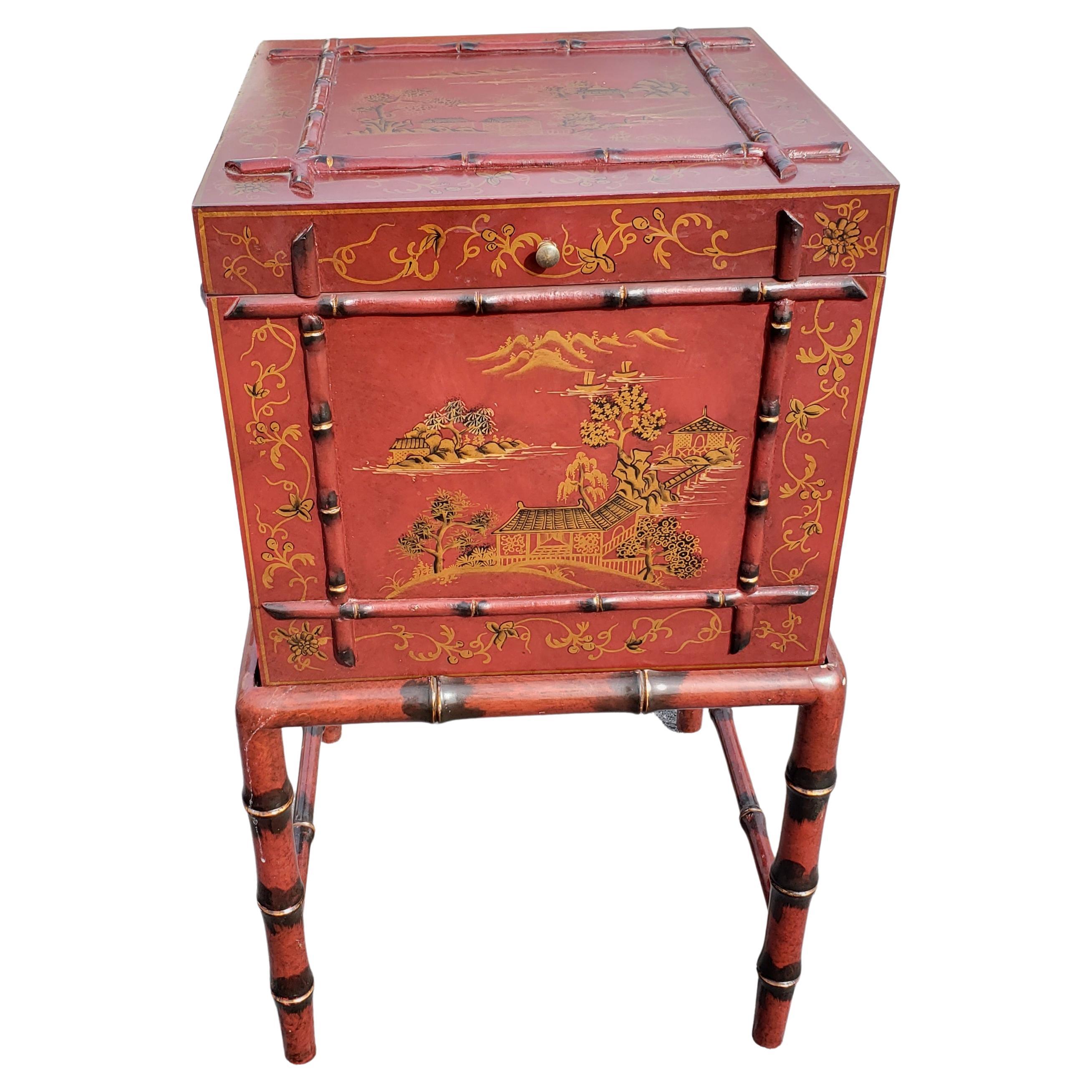 Theodore Alexander designed faux bamboo chinoiserie decorated flip top box table filing cabinet. Hand-painted on 3 sides and top with distinct scenes. Use it as a simple cabinet and table or as filing cabinet (removable files hanging rails