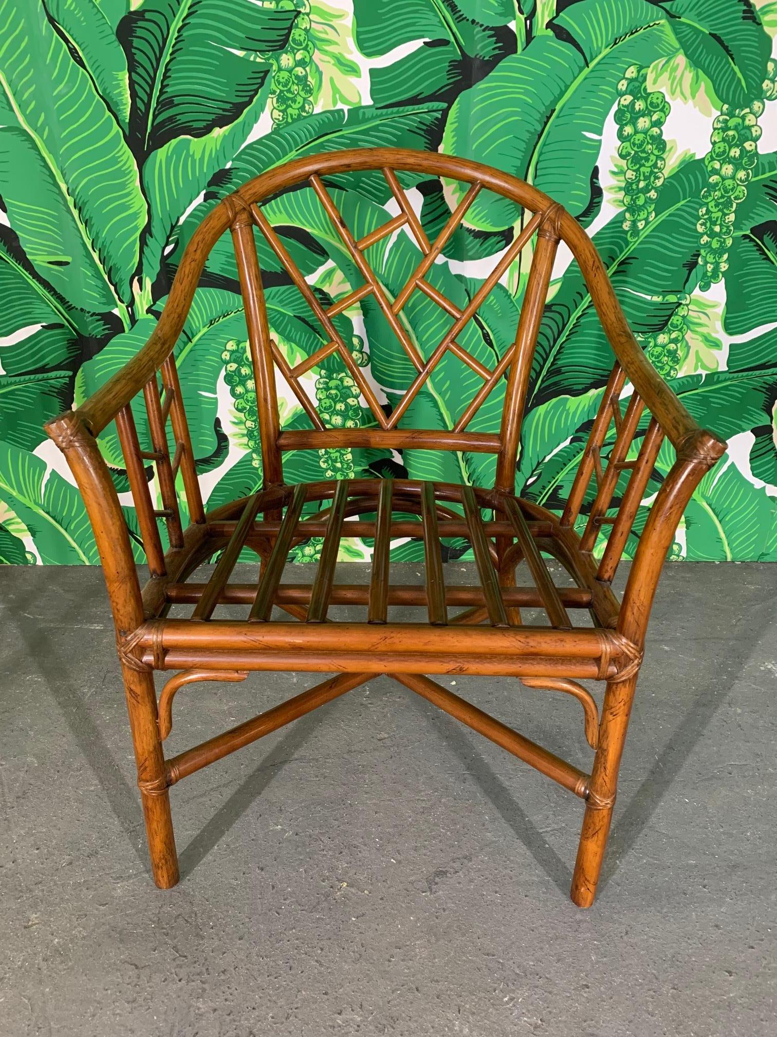 Set of 6 rattan arm chairs feature Asian chinoiserie style framework and a rich, deep brown natural finish. Very good condition with only very minor imperfections consistent with age.