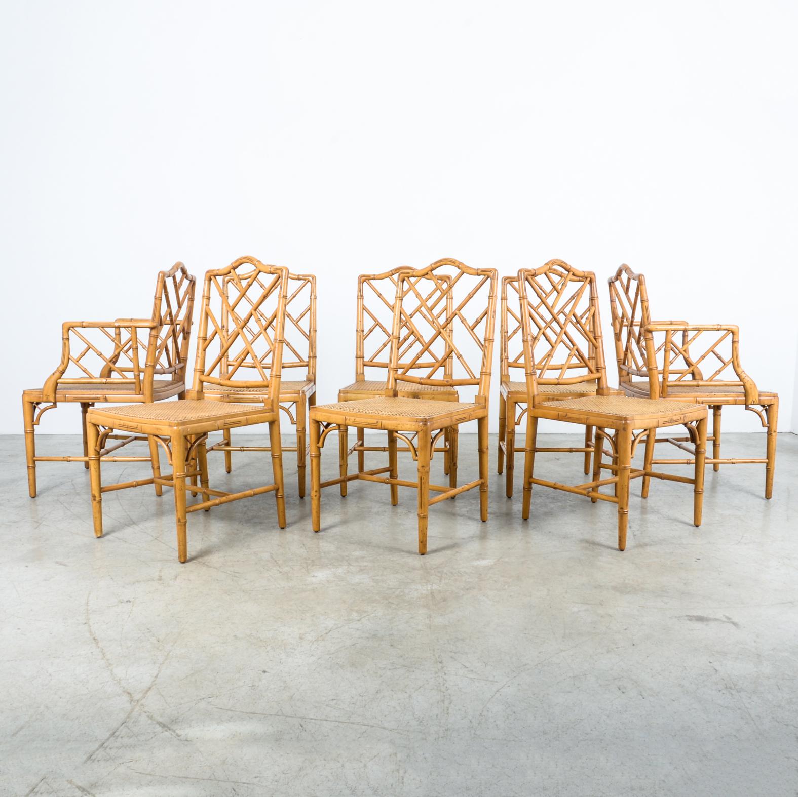 A 1970s German recreation of a Chippendale design, this faux-bamboo furniture has been adapted and adopted by designers and furniture makers since the 1700s. Seen here in Beech, with a woven seat, this set of eight features two head chairs with