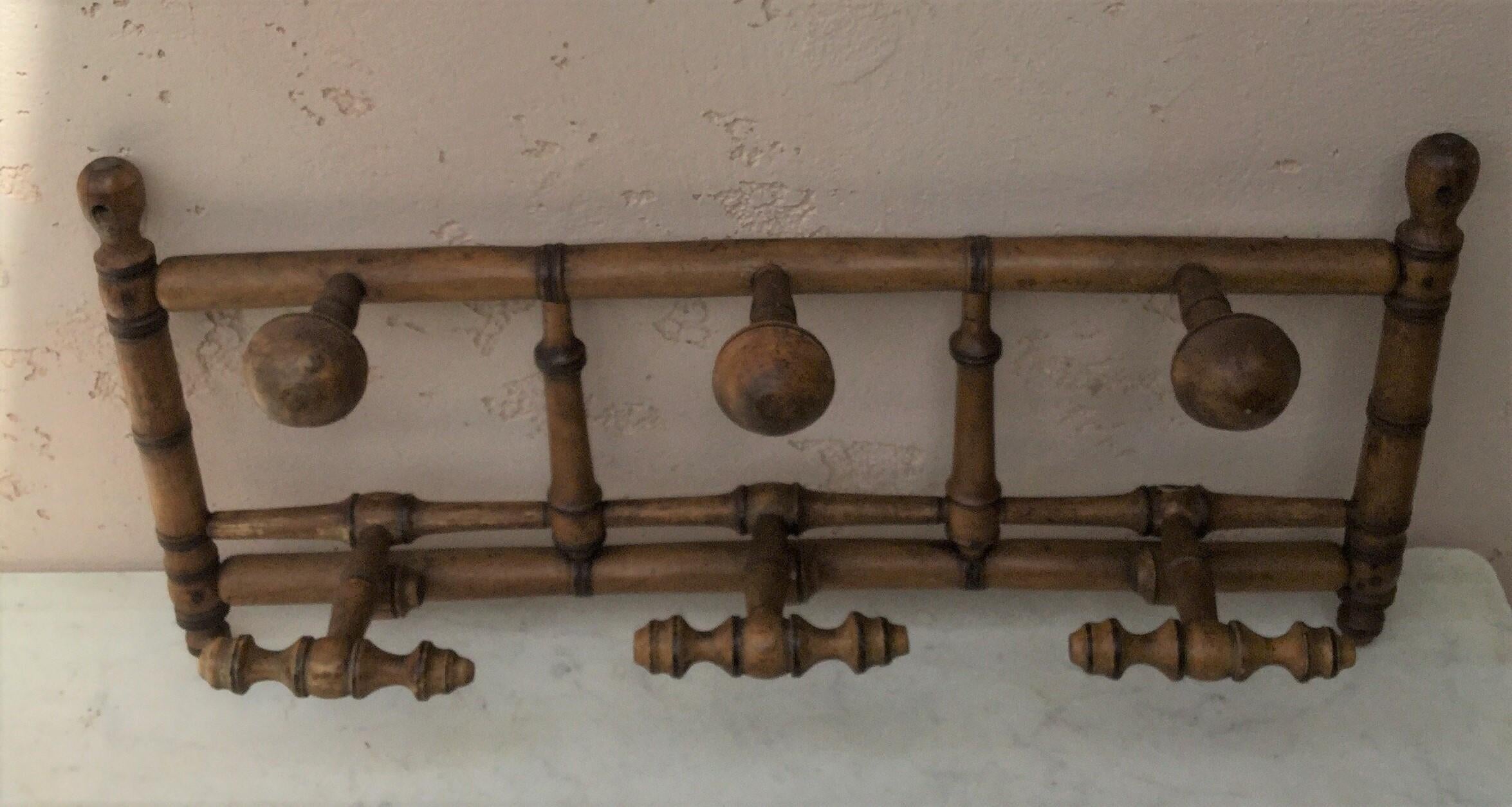 Faux bamboo coat rack circa 1900 with 3 hooks.