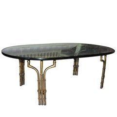 Table basse en fer doré et faux bambou