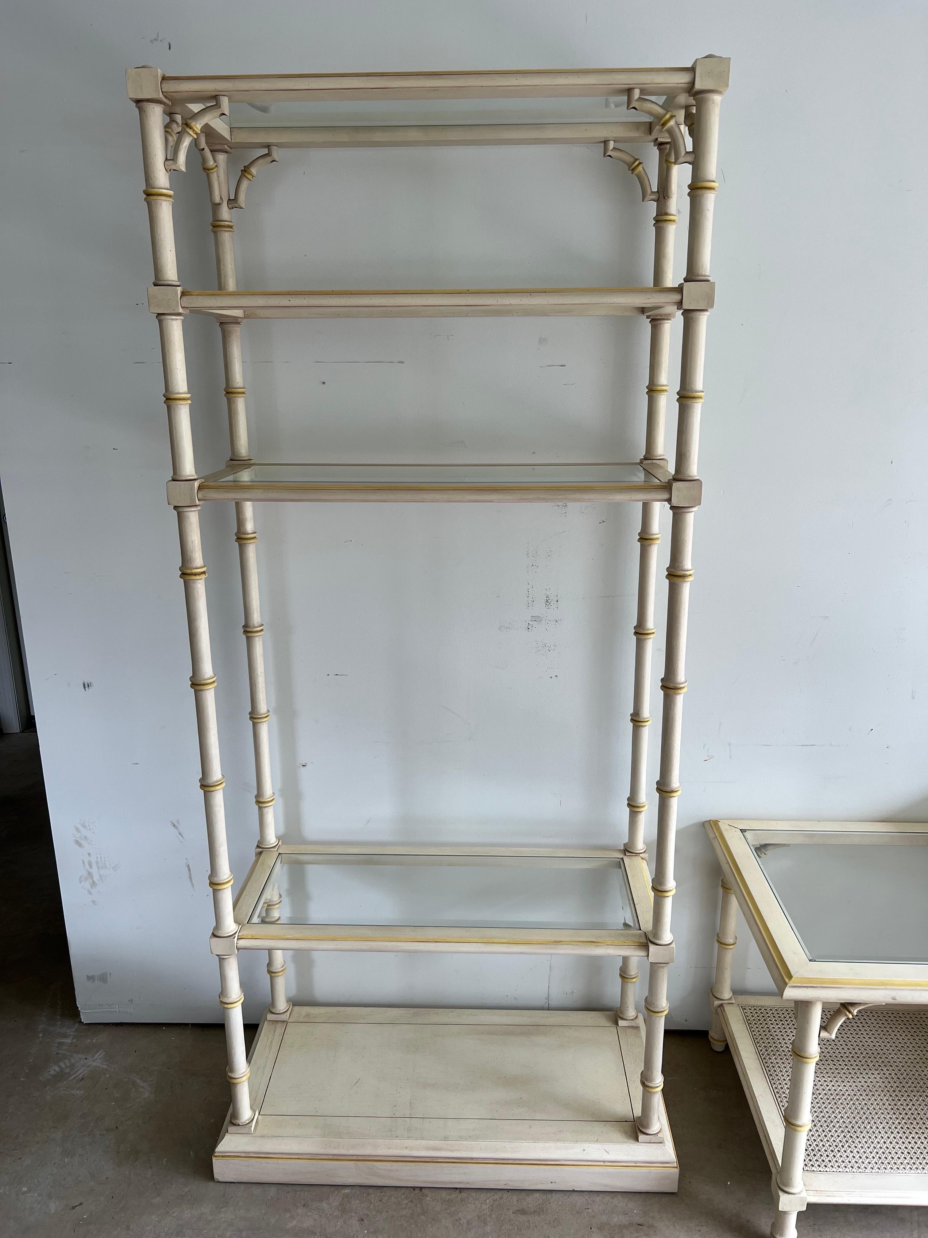 Faux Bamboo Etagere by Lane. 1970's style shelving. A cream colored plaette with soft yellow accent . Great piece for storing books or collectibles .Perfect for that Coastal look or use in an enclosed patio for plants. Matching side table also