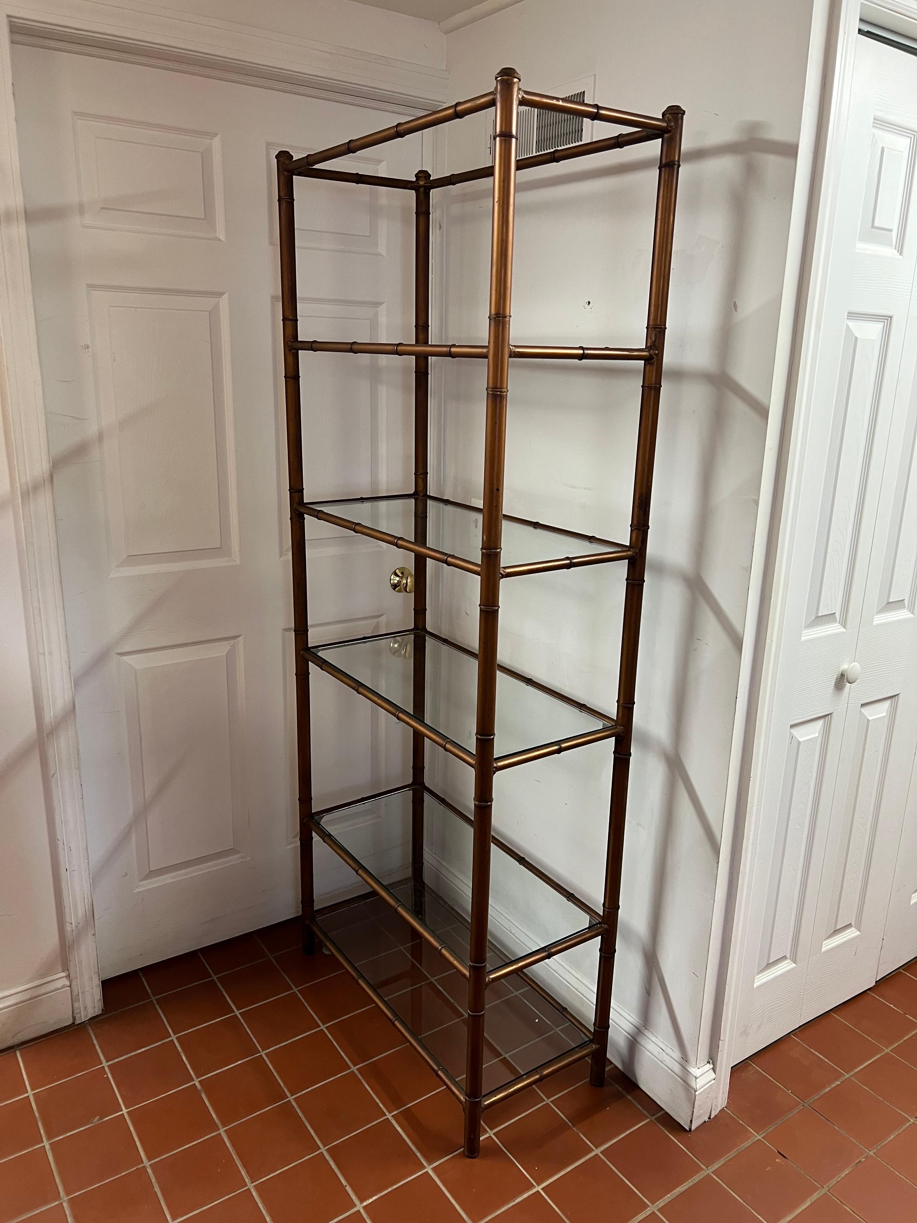 Classic Faux bamboo Etagere with oil glaze drip.  6 shelf bookcase perfect for display and storage for your living room or bedroom. Glass shelves are removable for eaasy transport. This finish is more on the copper side of brown.
Can be resprayed if