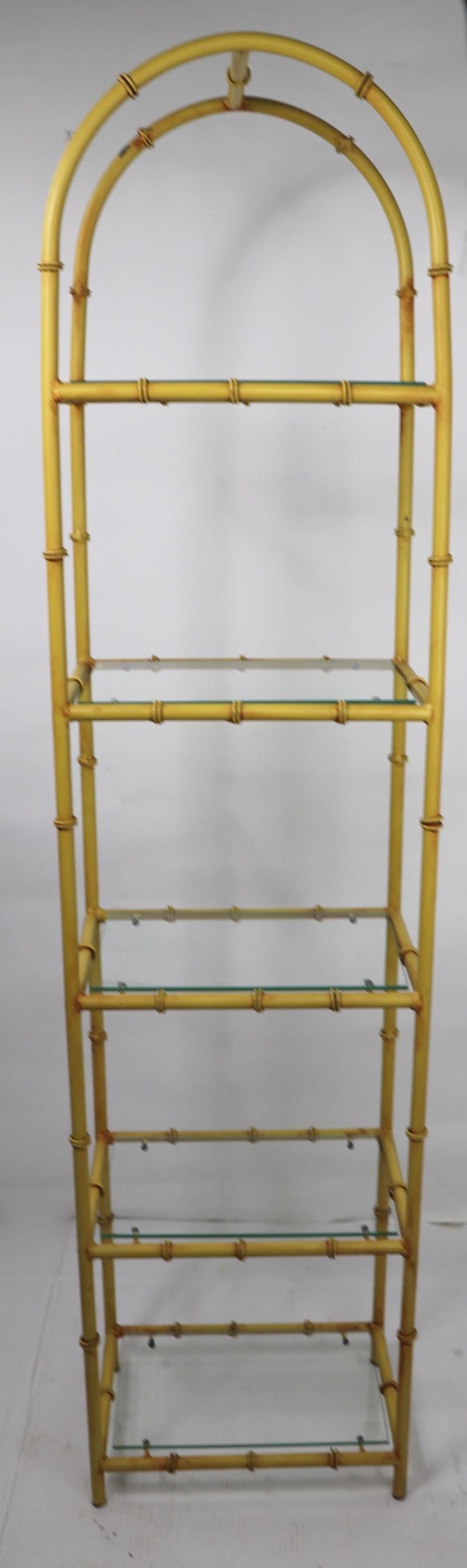 Stylish five shelf etagere having a faux bamboo iron frame, with glass shelves. Each shelf is 15.25 inch W x 10 inch deep, with 13 inches between each shelf.