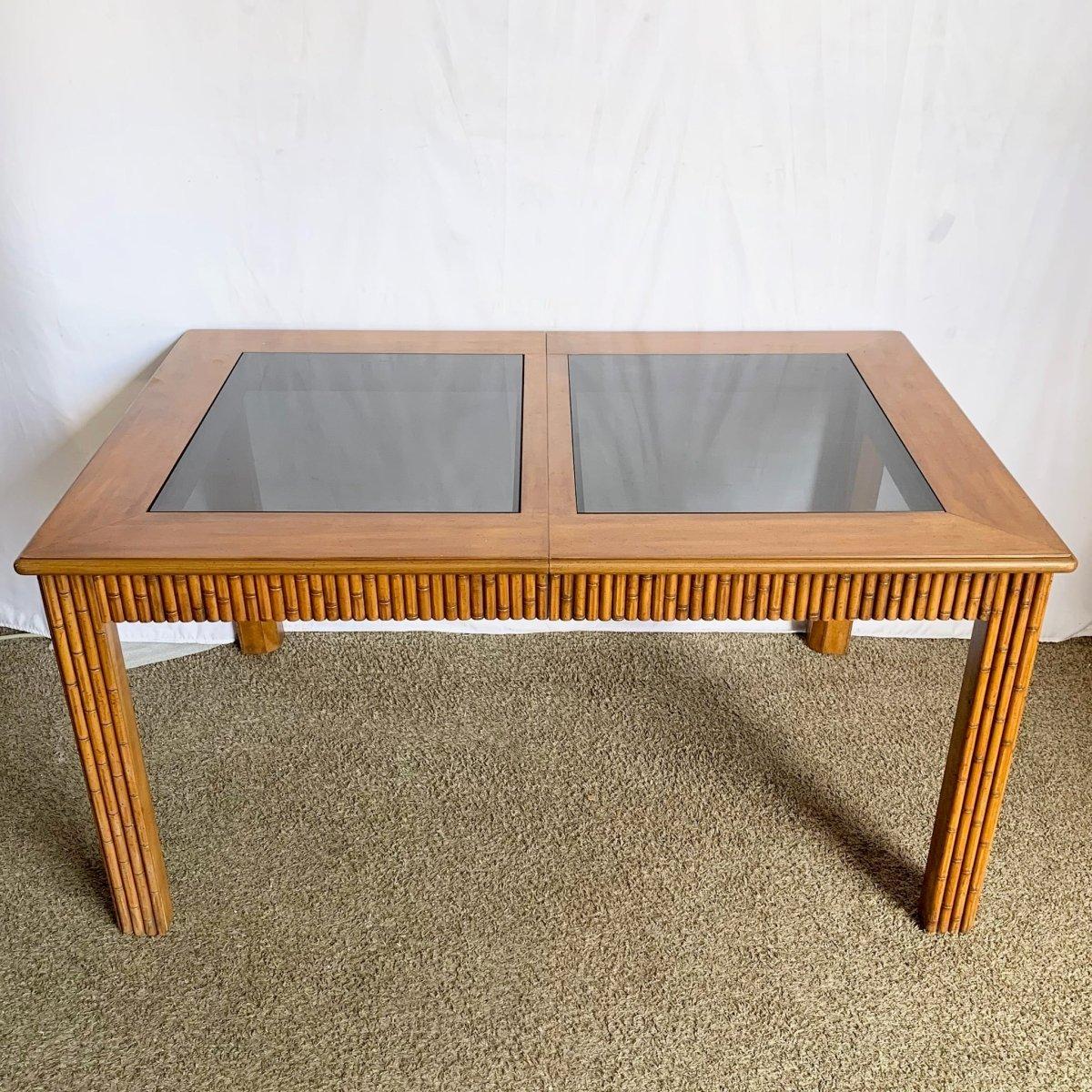 Mid‑Century Faux Bamboo Extendable Dining Table blends textured warmth with sleek smoked glass and flexible function for refined retro interiors.
 

 Minor wear to the finish as shown in the photos. 
 

 We sell items as acquired, without restoring