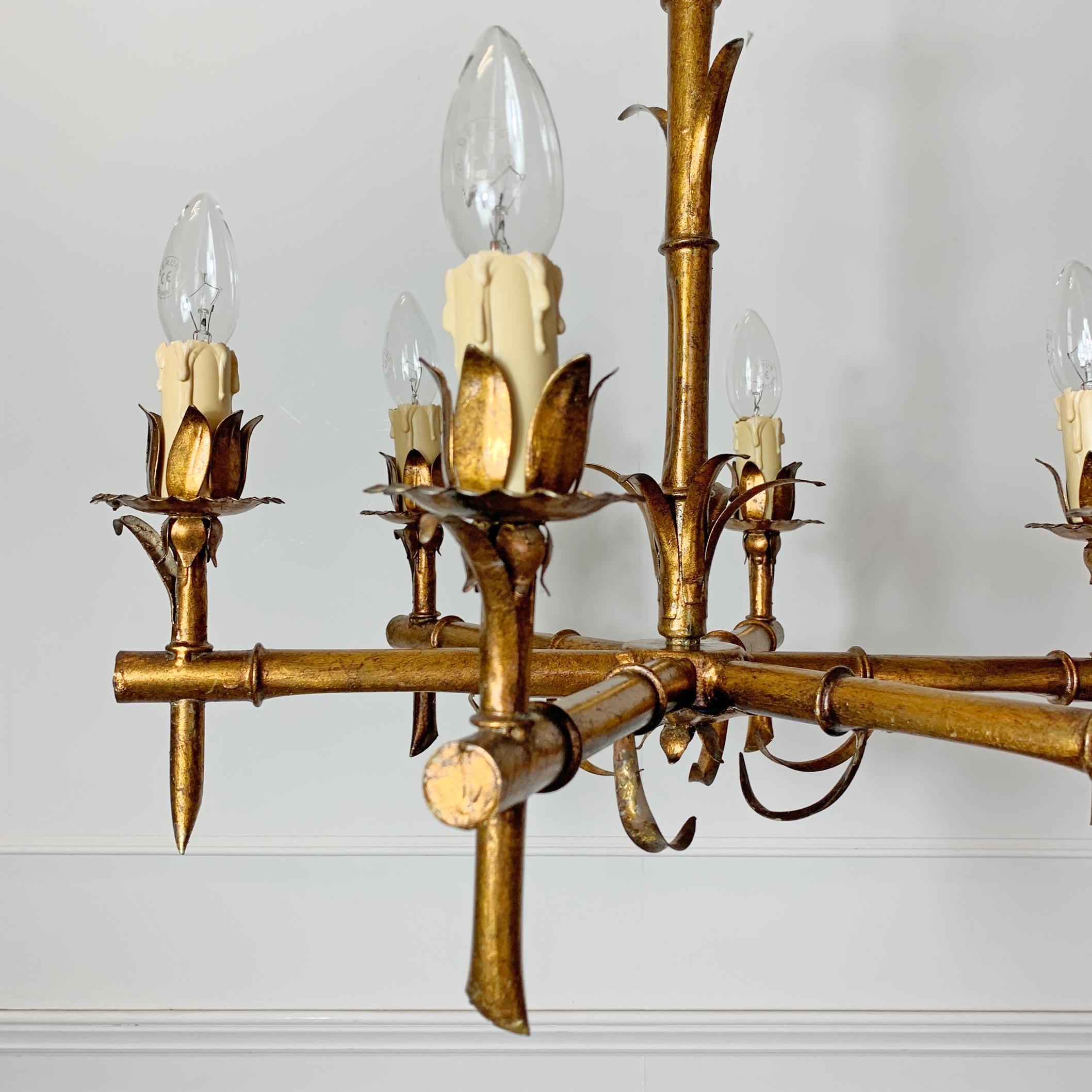 1950s French faux bamboo gilt chandelier
Stunning faux bamboo gilt metal chandelier
France, circa 1950s
The light has 6 arms each with single bulb holder and faux candle sleeve
The original gilt color is a warm soft dark gold
Gilt metal scalloped