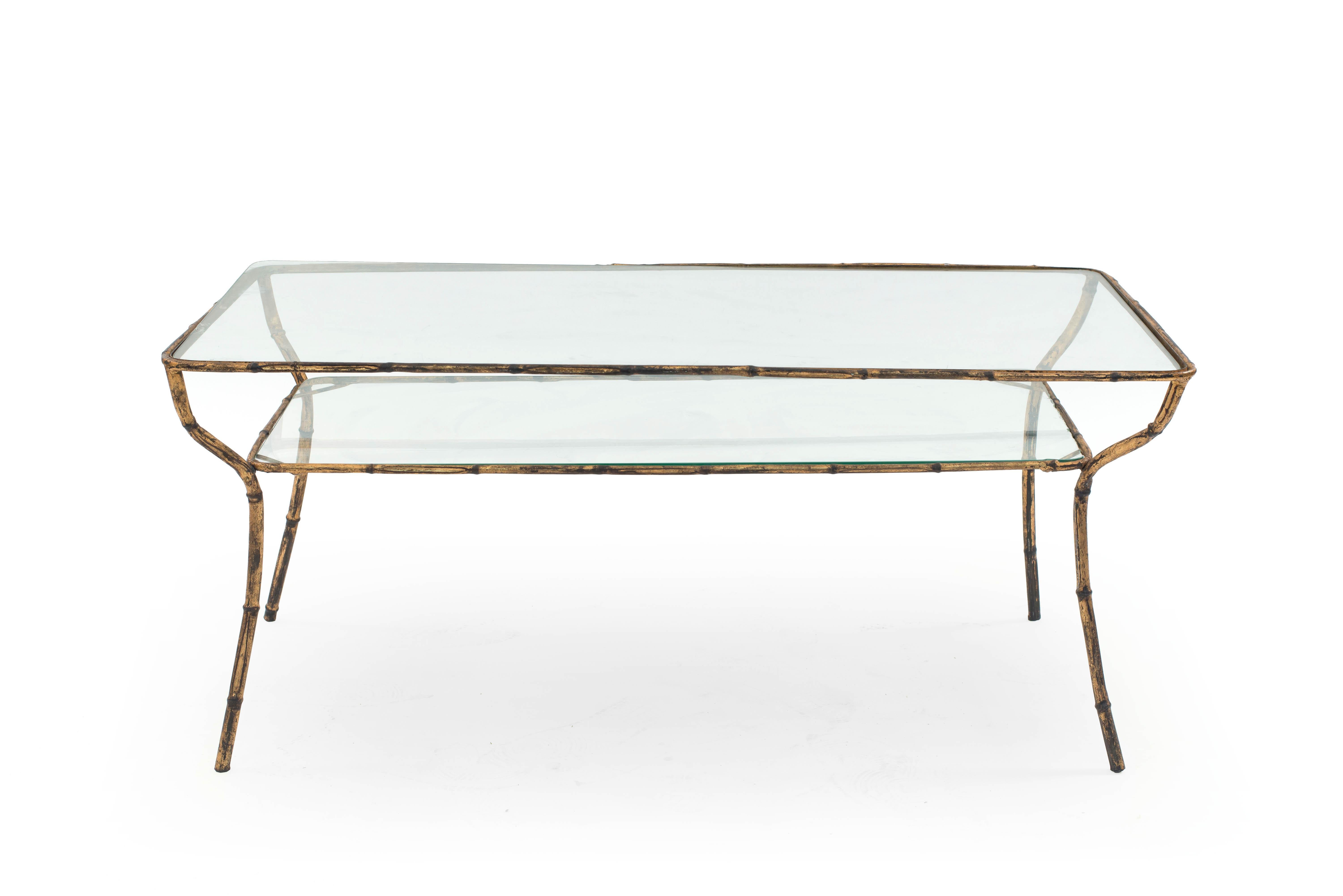 Faux Bamboo (1940s) style gilt metal base coffee table with rectangular glass top and shelf.