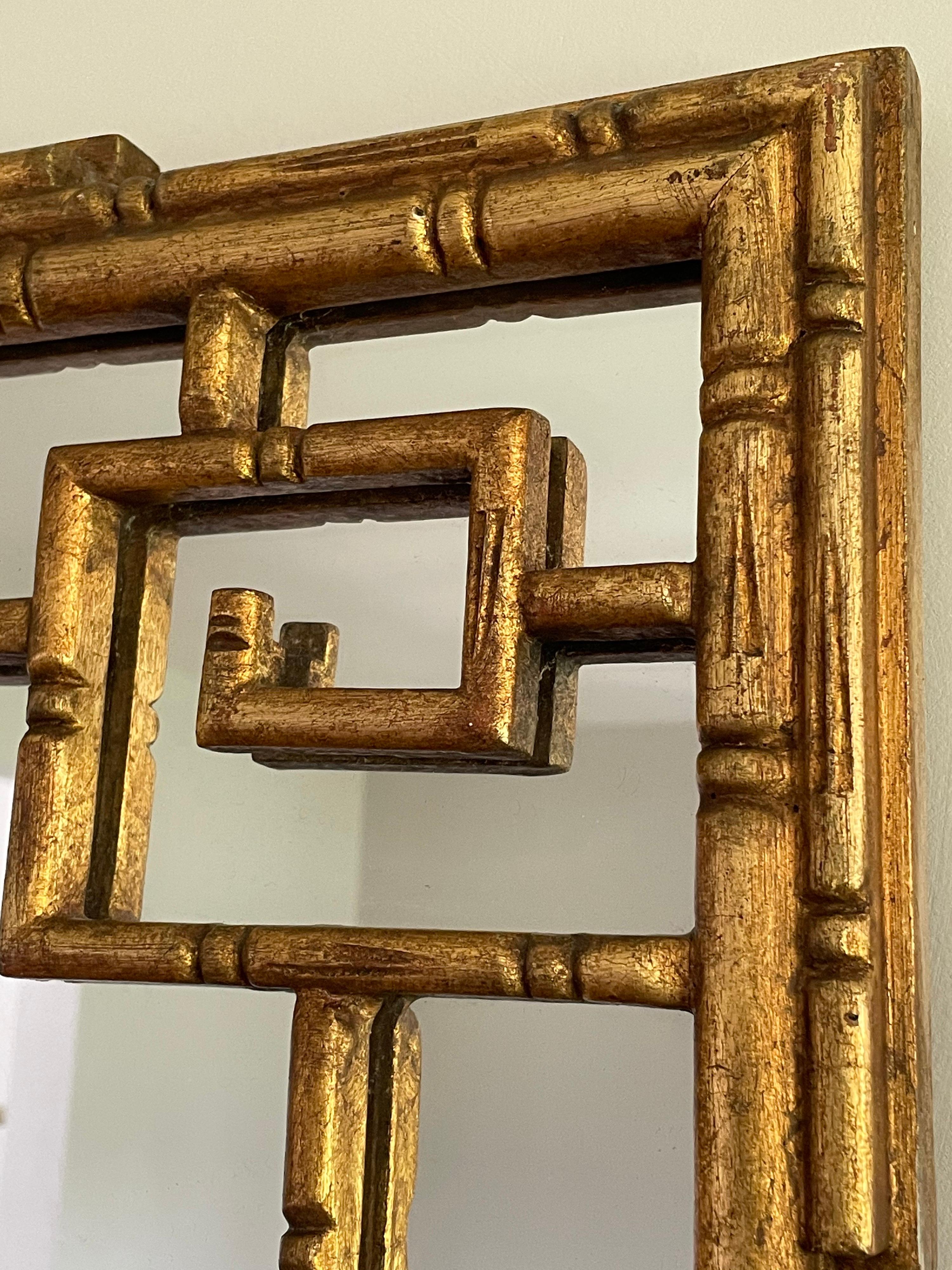 Unusual faux bamboo vintage mirror in a Greek key motif. Very good condition, some loss to paper backing as seen. Heavy and well constructed. 

Measures: 34