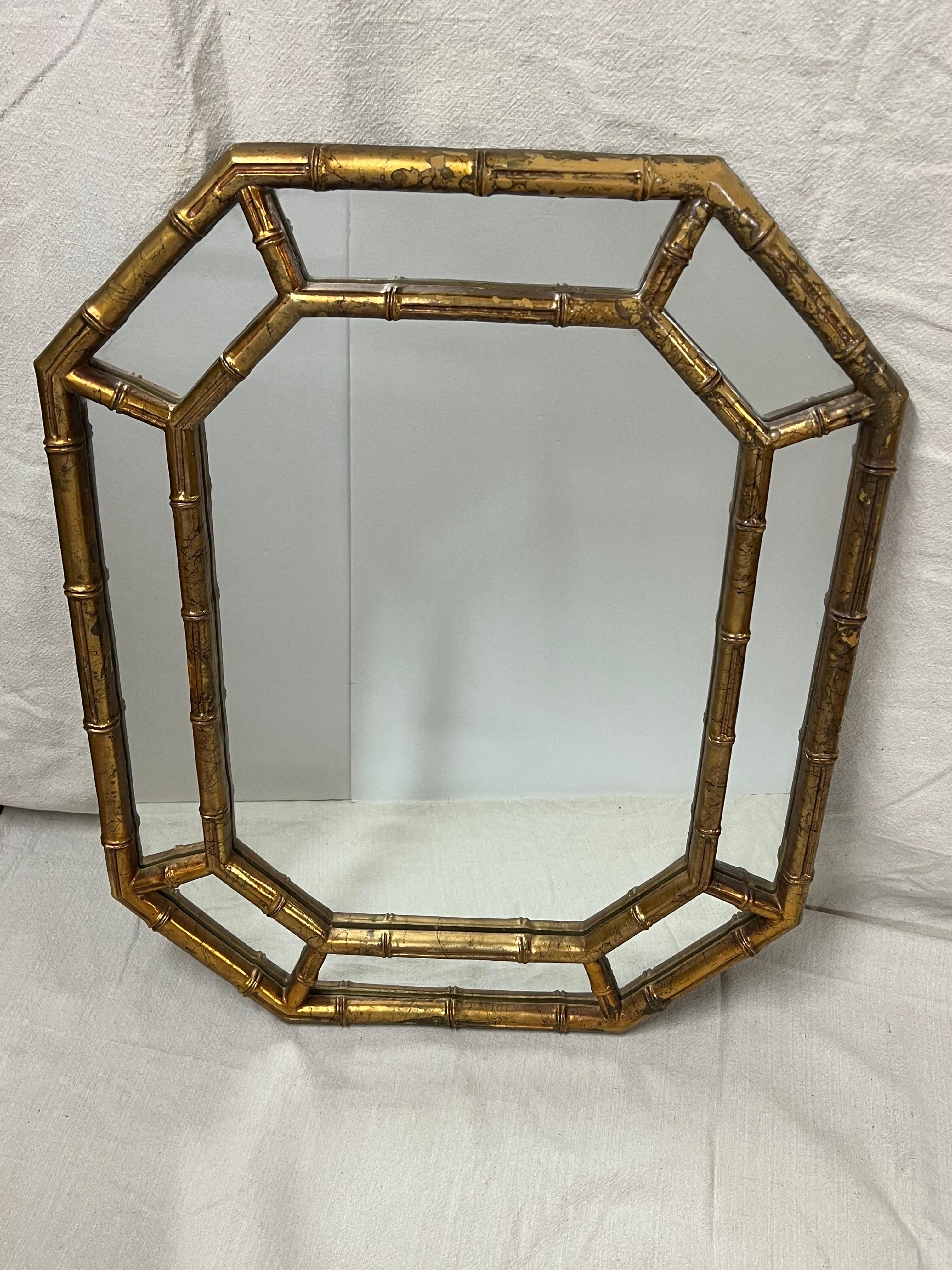 Faux bamboo gilt octagonal mirror, Nice vintage mirror . Perfect for a hallway or a small powder room. Classic style and design. Made of composition