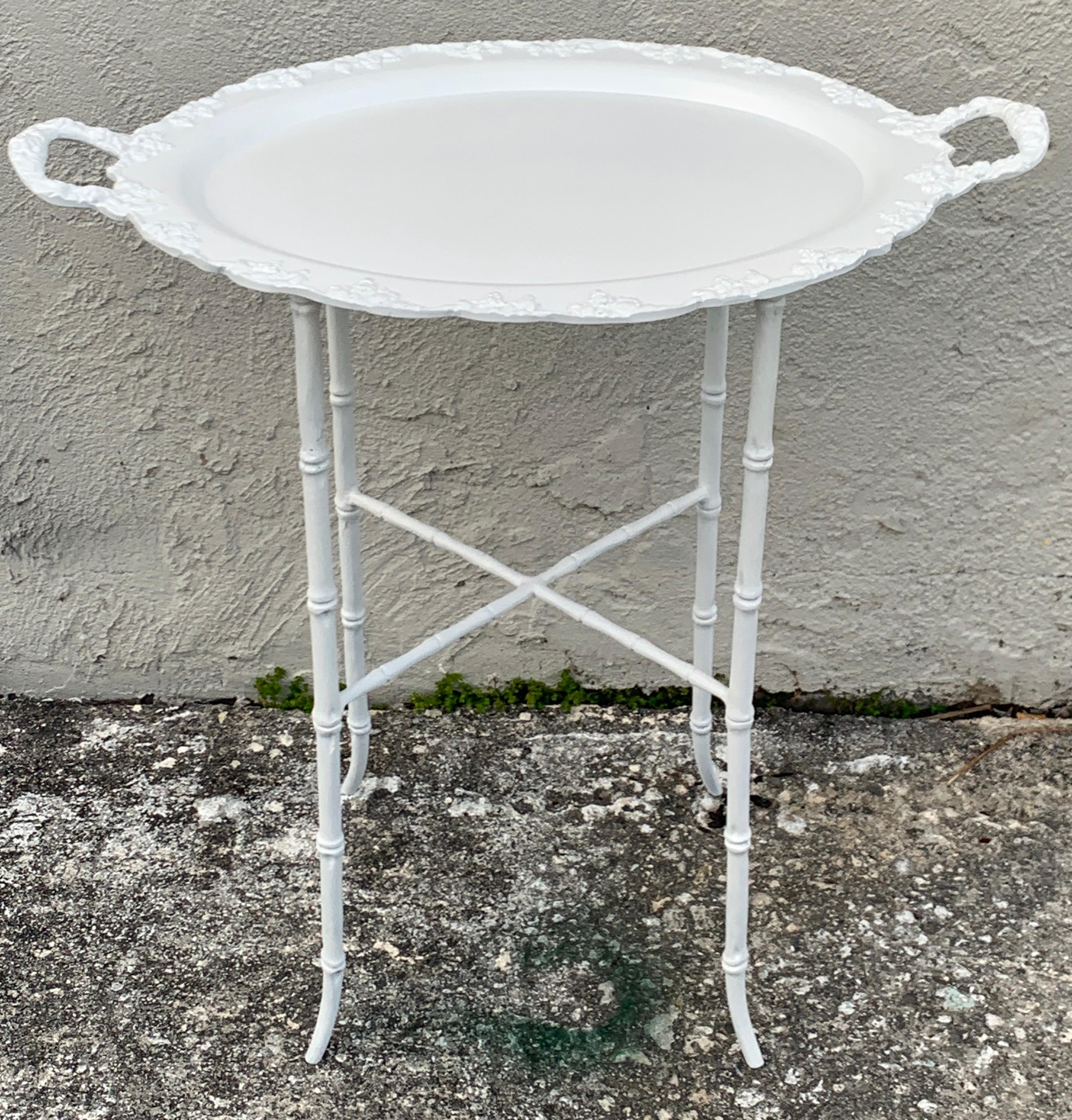 Faux bamboo and grape motif white enameled tray table, Provenance Celine Dion
In two parts, enameled iron 
Base measures 11