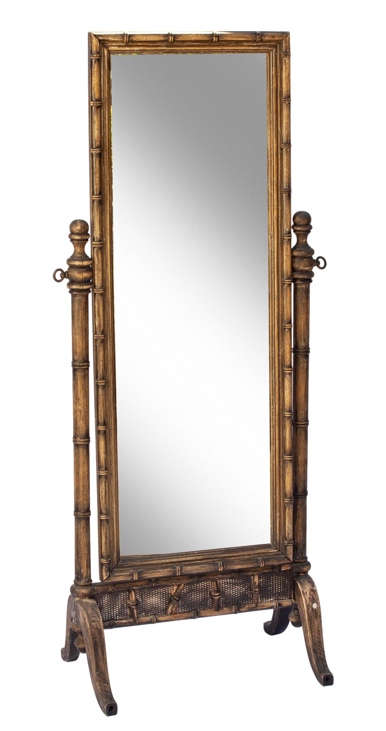 Henry Link faux bamboo cheval mirror. 
Vintage stripped hardwood Henry Link faux bamboo mirror in an elongated rectangular frame bordering the cheval mirror on a very sturdy stand with full hardwood backing. The full length mirror has adjustable