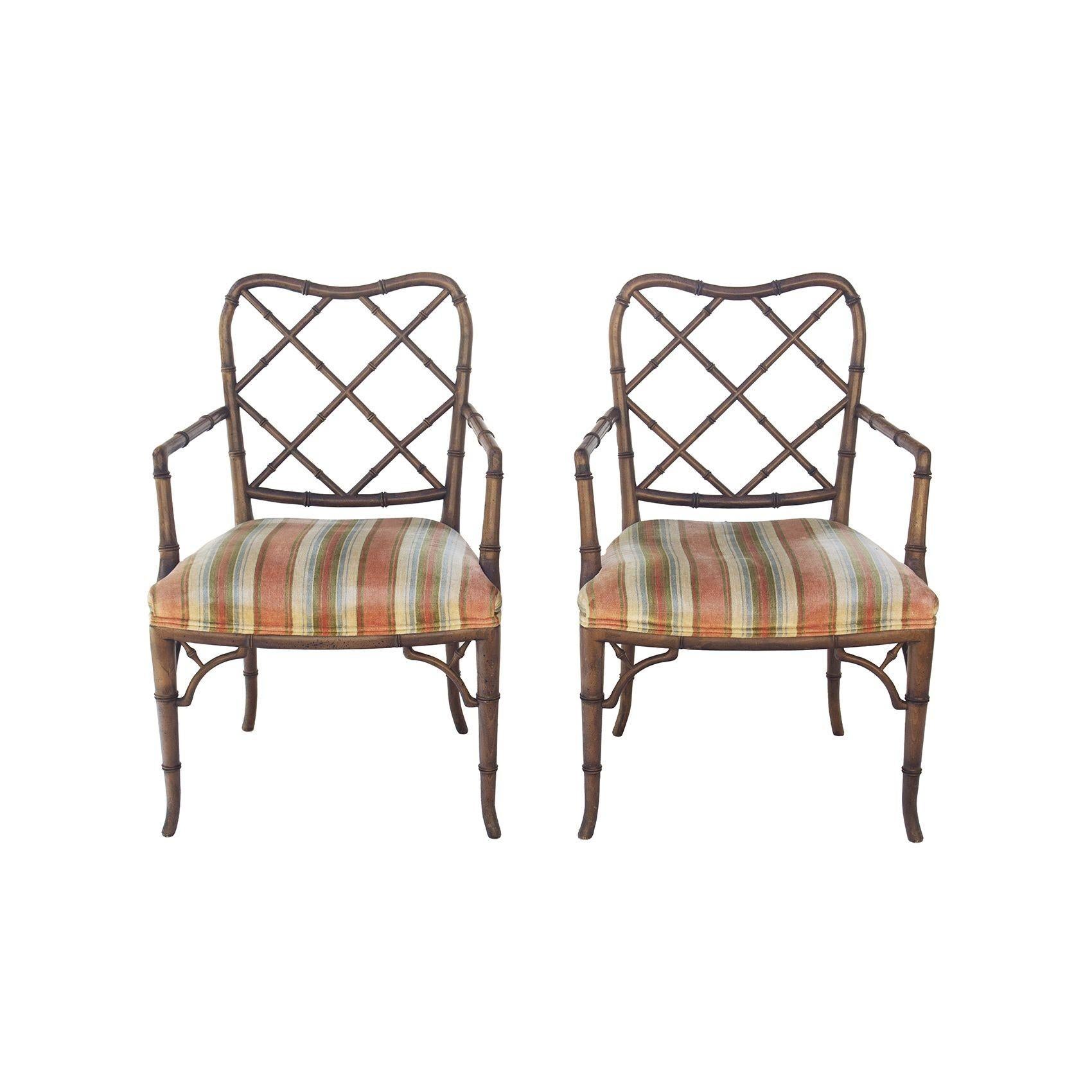 USA, 1950s
Pair of faux bamboo Hollywood Regency armchairs. Elegant and classic dining or side chairs. These had a swatch of the same seat fabric nearby labeled 'Henredon', so they are believed to be made by Henredon, though no labels remain on the