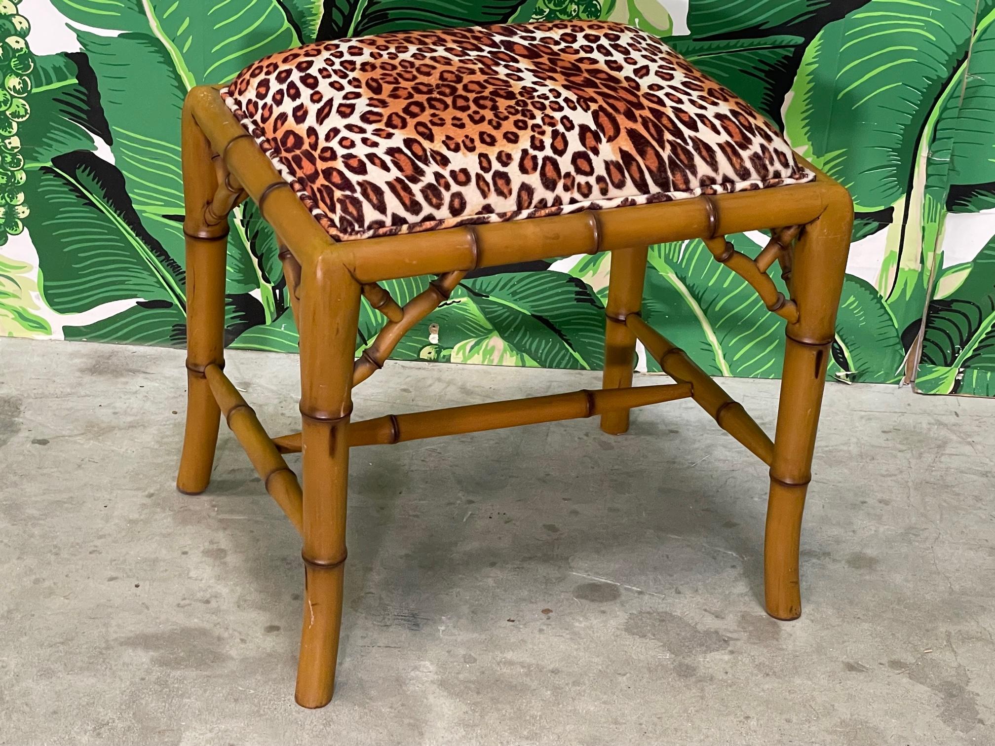 Faux bamboo footstool or ottoman features a soft, leopard print fabric and slightly splayed legs. Good condition with imperfections consistent with age, see photos for condition details.
For a shipping quote to your exact zip code, please message