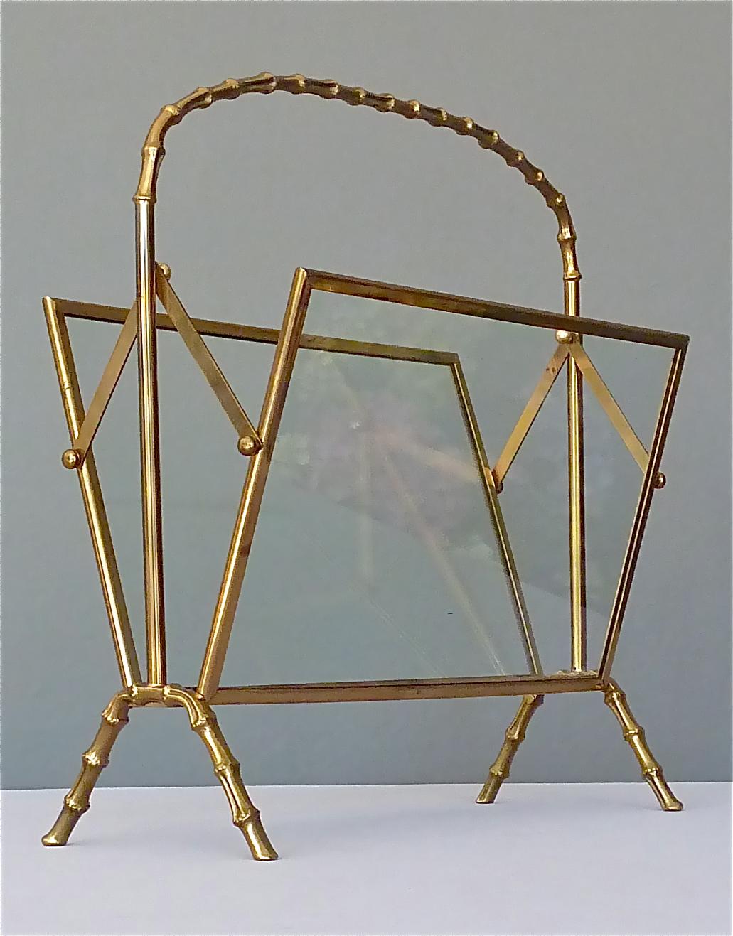 A very nice faux bamboo patinated brass and glass magazine holder or stand by Maison Baguès comparable to Maison Jansen and Maison Charles, France, circa 1950. This vintage piece is made of patinated brass and glass. It has a good weight for a good