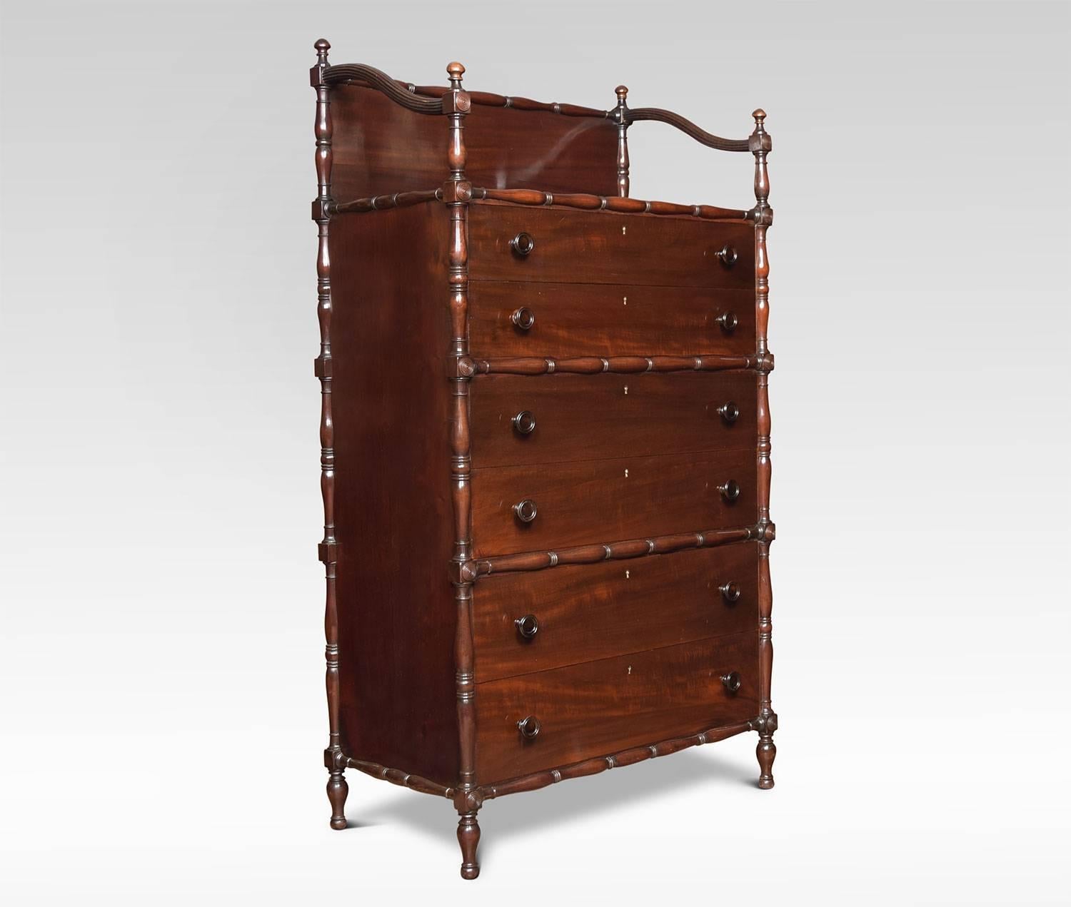 Mahogany chest of draws the rectangular top with spindle gallery over six long drawers with paneled fronts. Flanked by faux bamboo columns all raised up on turned legs.
Dimensions:
Height 59.5 inches
Width 32.5 inches
Depth 18 inches.