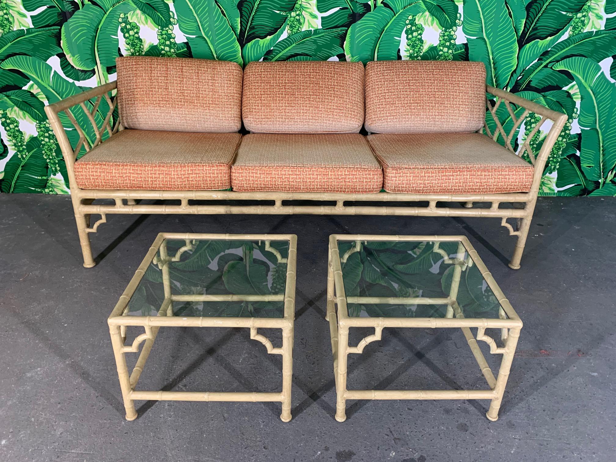 Vintage patio sofa by Meadowcraft features faux bamboo metal frame and Asian chinoiserie detailing. Very good condition with minor imperfections consistent with age, along with fading to cushions.
Sofa measures:
76