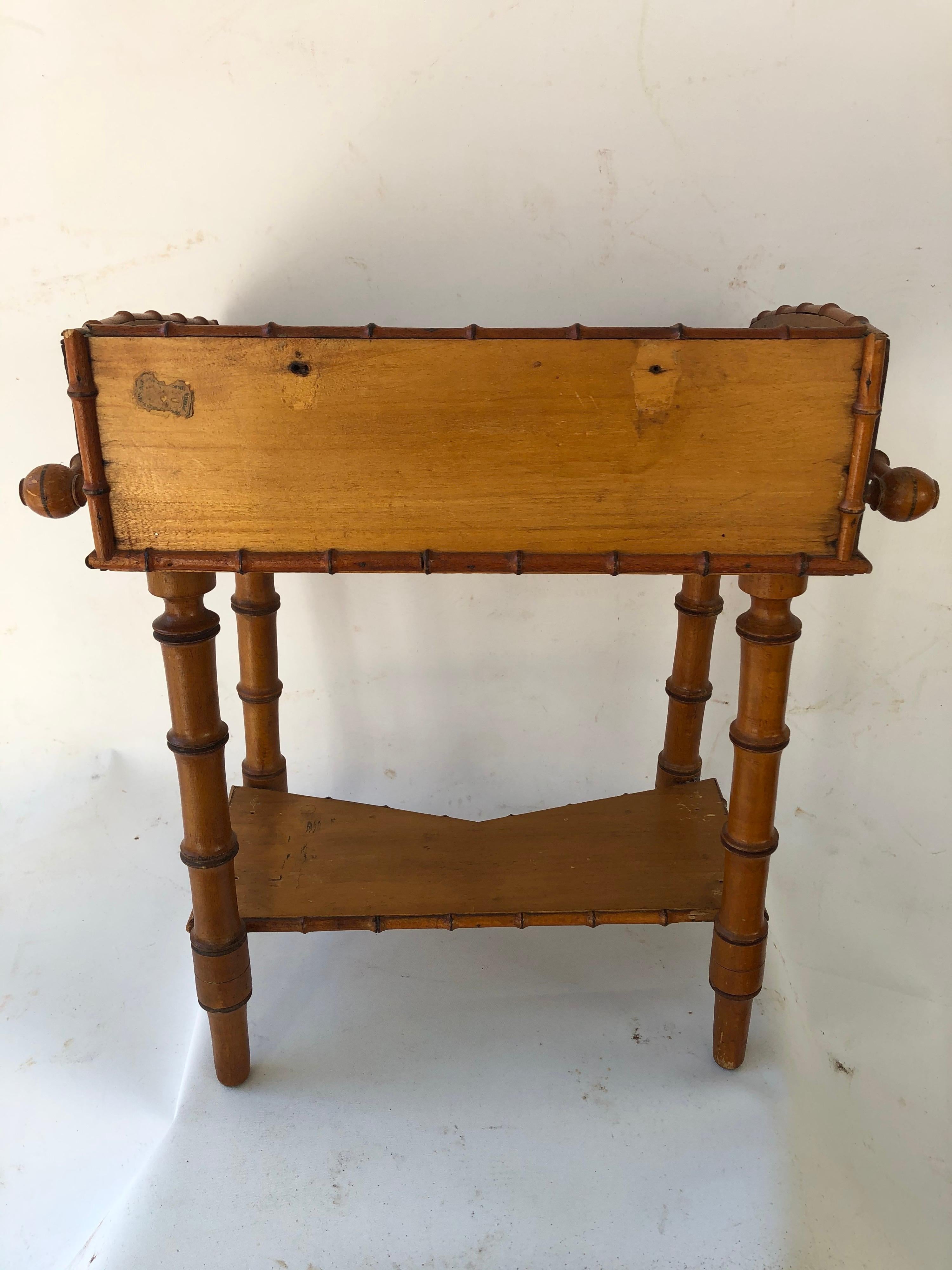 Beautifully crafted faux bamboo miniature washstand with white marble top and one drawer. Probably Victorian era salesman's sample or made by a talented hobbyist. Also works well as a small table next to a
chair or sofa.
