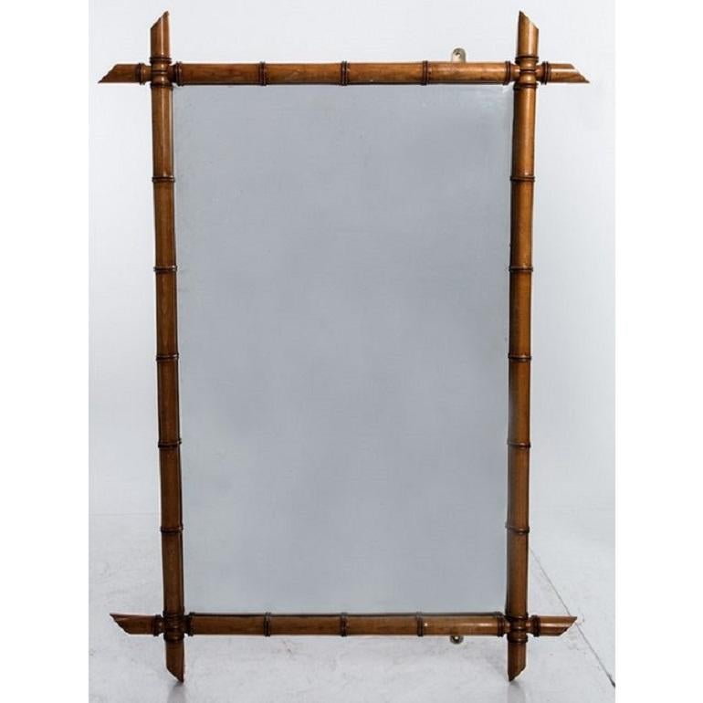 Large faux bamboo mirror reflecting the popular chinoiserie style of the 1890s.