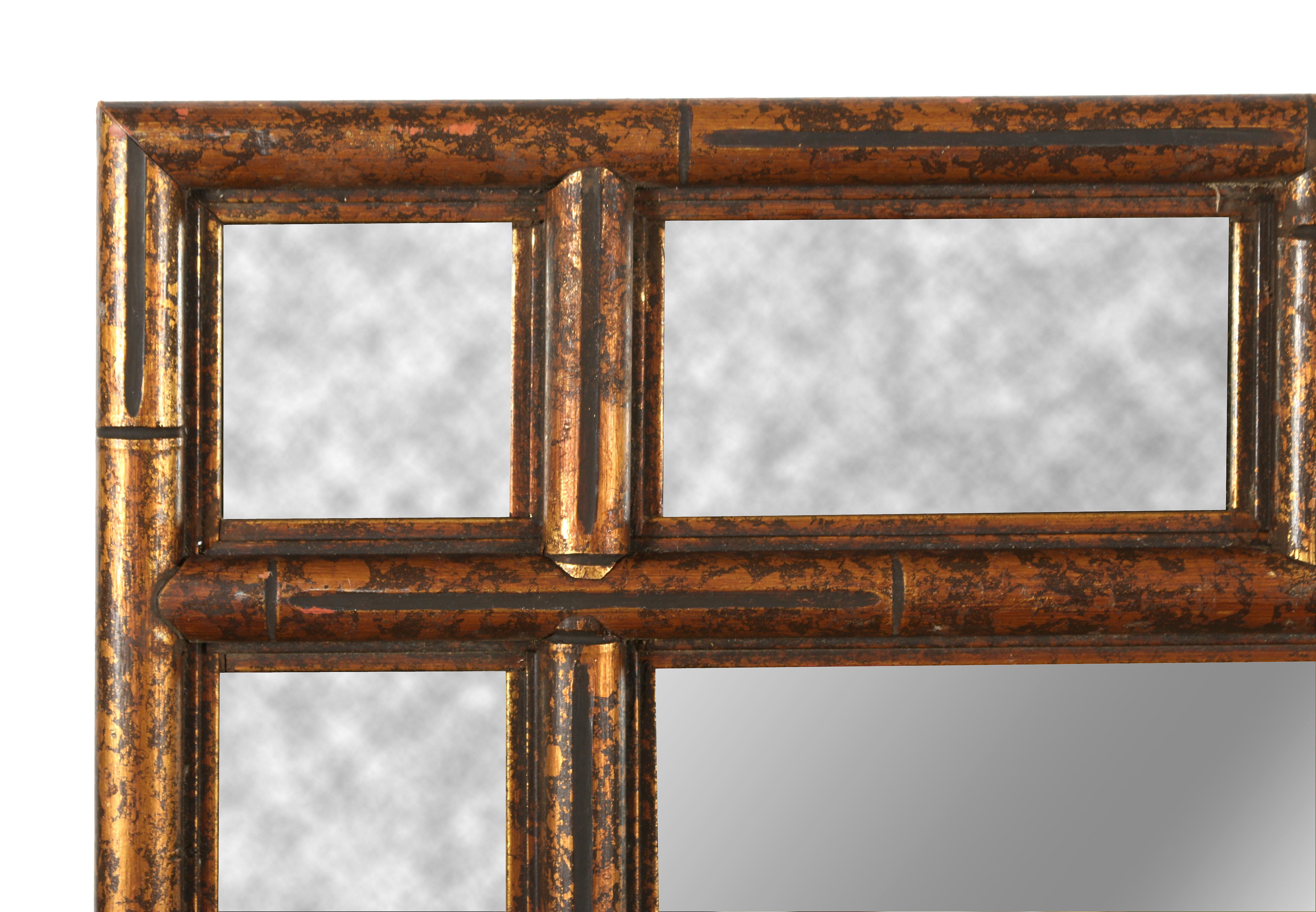 A large faux bamboo mirror in a gilt wood finish. This piece has a lot of personality and would look great in an entrance, dining room or anywhere!