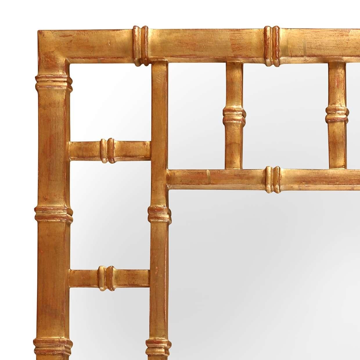 A striking giltwood mirror with a faux bamboo frame, echoing the timeless charm of chinoiserie design. The rich gold finish adds warmth and glamour, making it a perfect accent for both traditional and eclectic interiors.