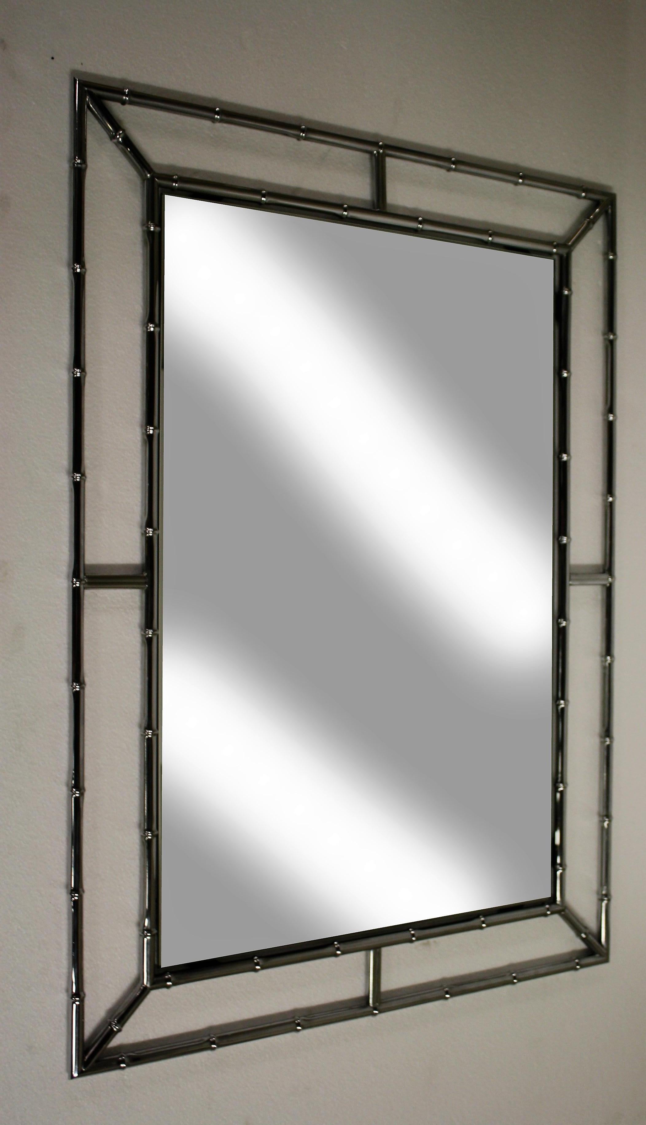 Chrome faux bamboo mirror.

Good condition, slight patina.

France, 1960s.

Dimensions:
Height 103cm/40.55